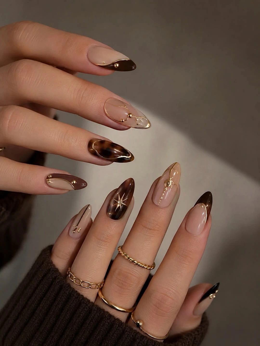 fall trendy nails 2026 sheer brown almond nails with delicate gold accents