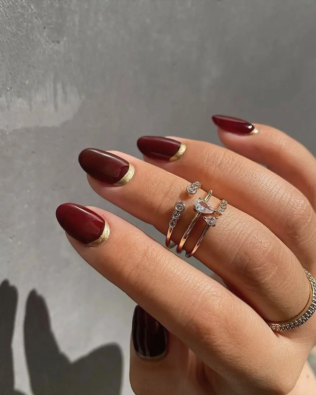 Fall wedding nails 2026 Classic Burgundy Nails with Delicate Gold Half Moons