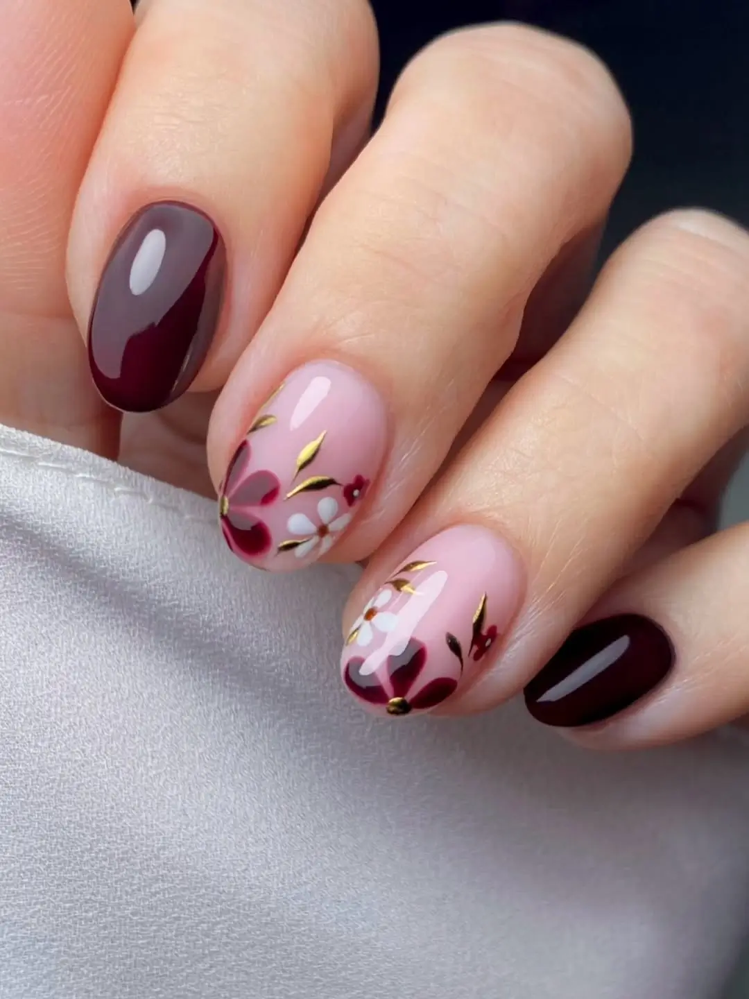 Fall wedding nails 2026 Short Burgundy Floral Nails with Gold Leaf Details