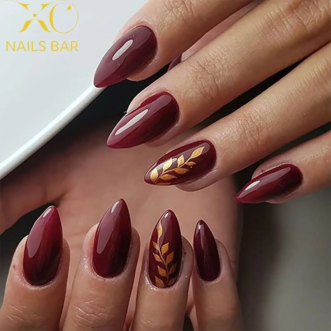 Fall wedding nails 2026 Deep Burgundy Nails with Golden Autumn Leaves