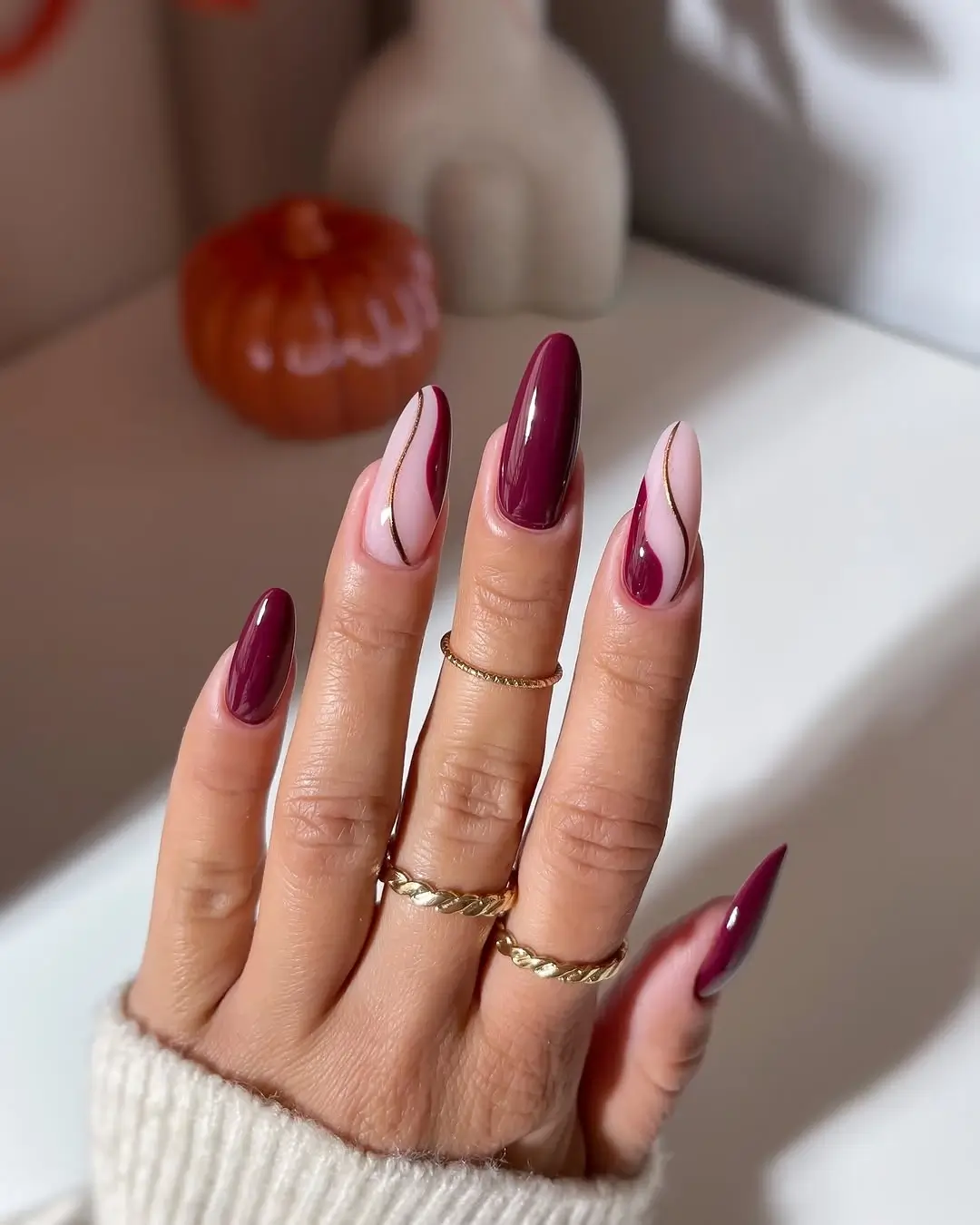 Fall wedding nails 2026 Elegant Burgundy Waves with Delicate Gold Details