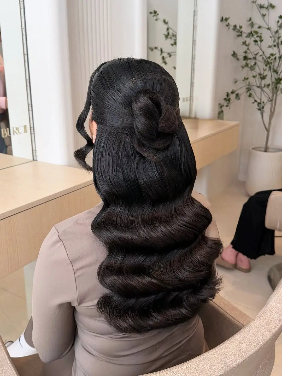 middle parting hairstyles Glossy Half-Up Bow With Sculpted Waves