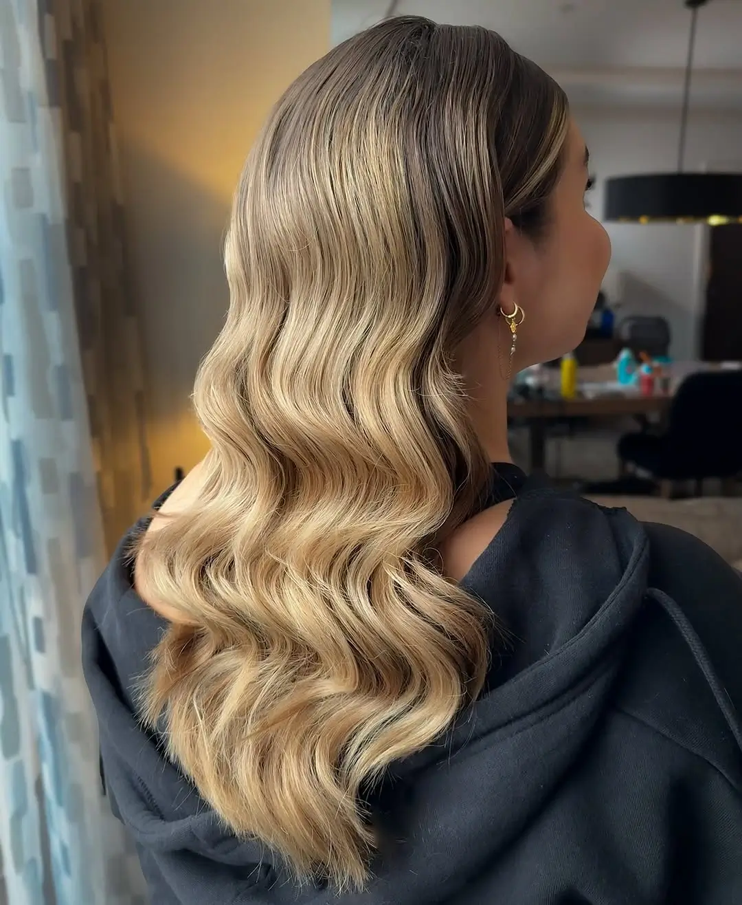 middle parting hairstyles Soft Blonde Waves With a Polished Center Part
