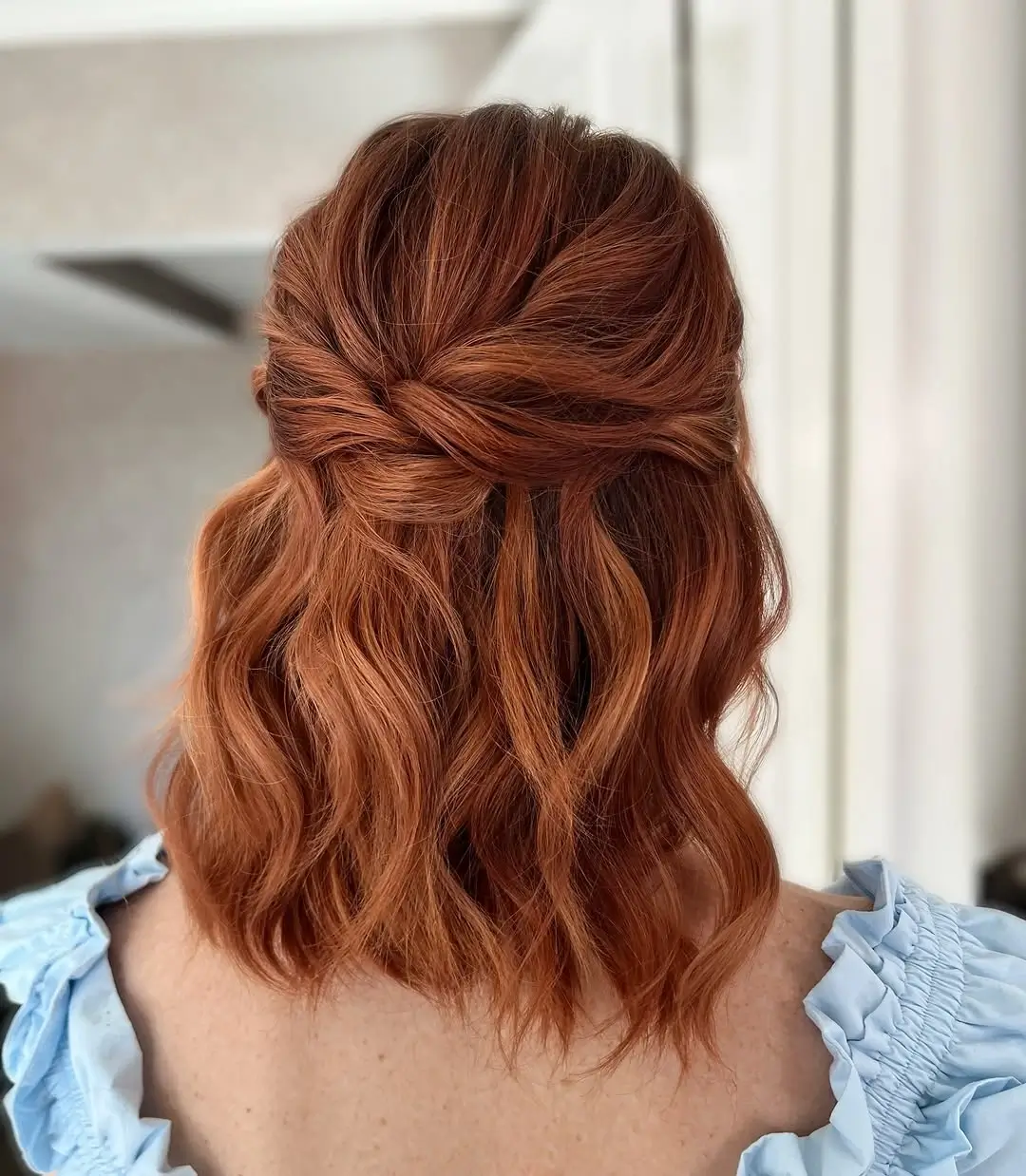 middle parting hairstyles Copper Half-Up Twist With Romantic Waves