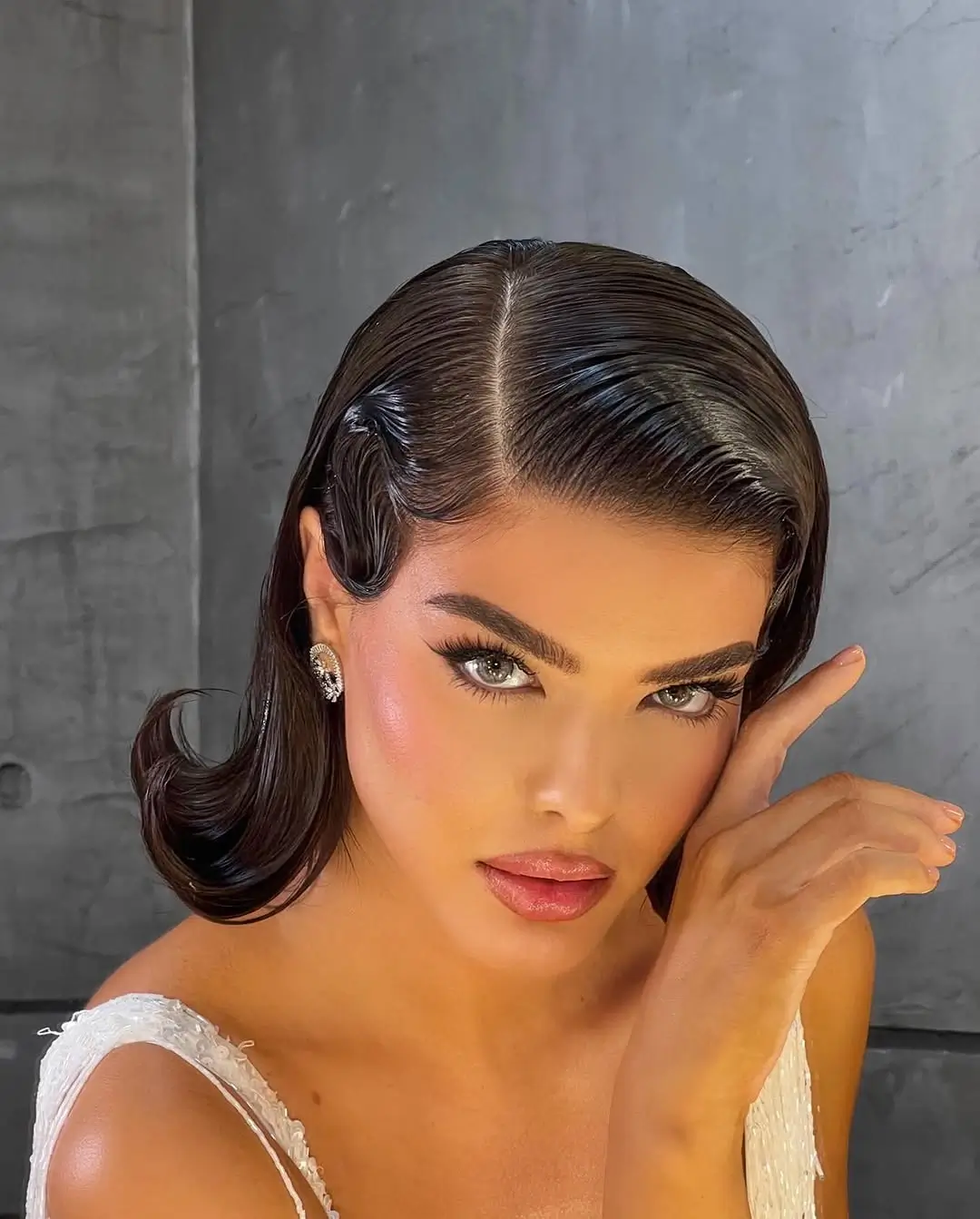 middle parting hairstyles Sculpted Short Waves With a Modern Bridal Finish