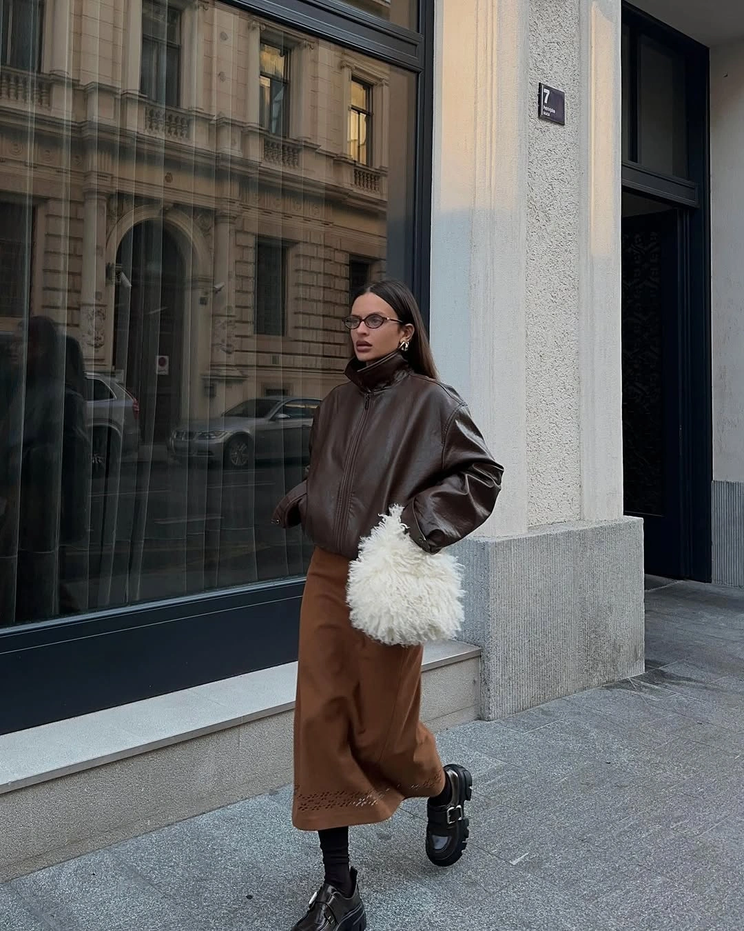 September fashion trends 2026 chocolate leather jacket and brown midi skirt