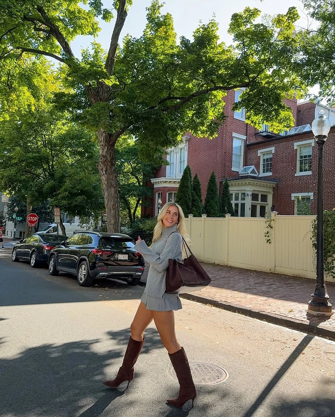 September fashion trends 2026 gray knit set and brown knee-high boots