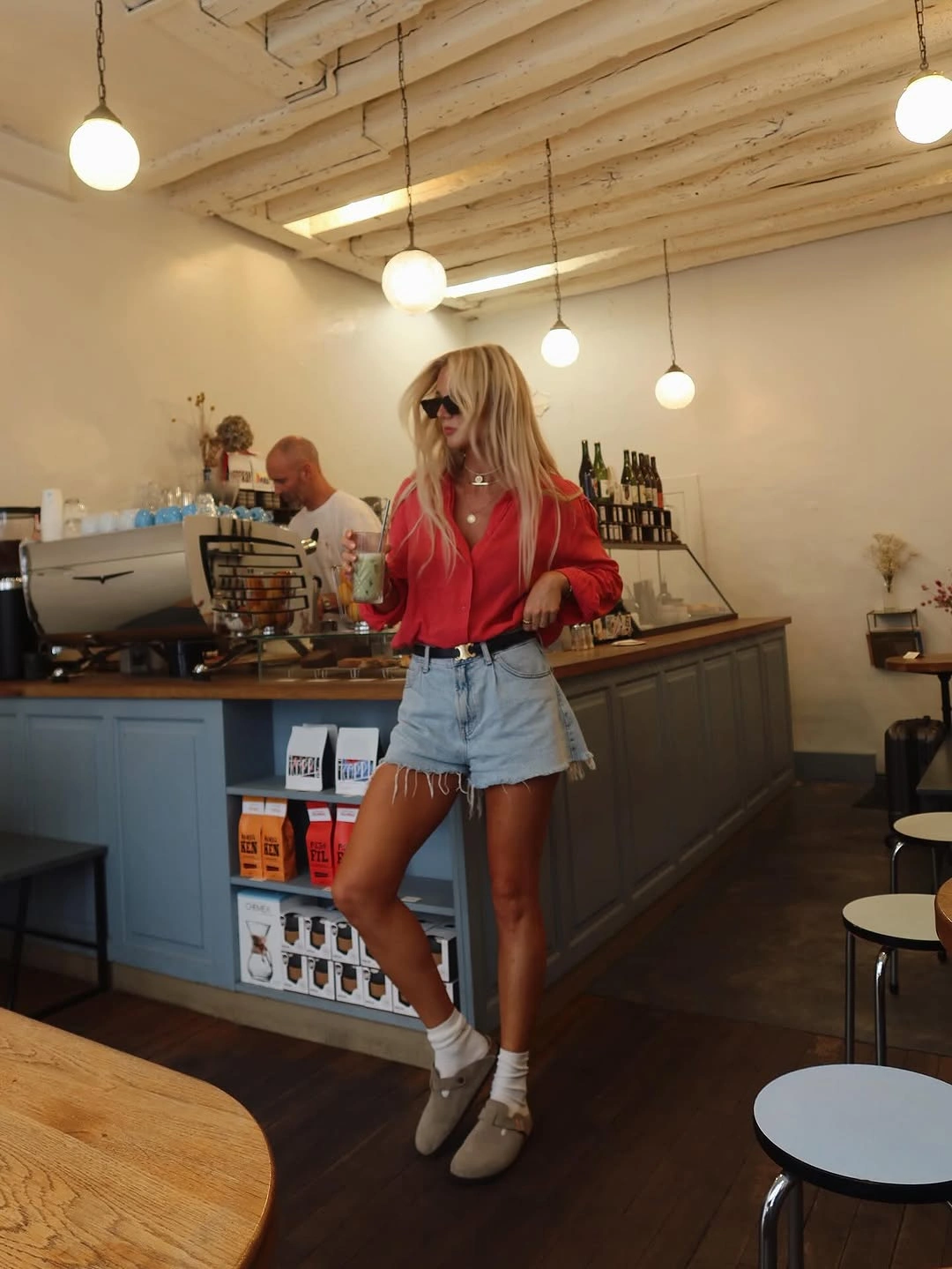 September fashion trends 2026 red shirt and denim shorts outfit