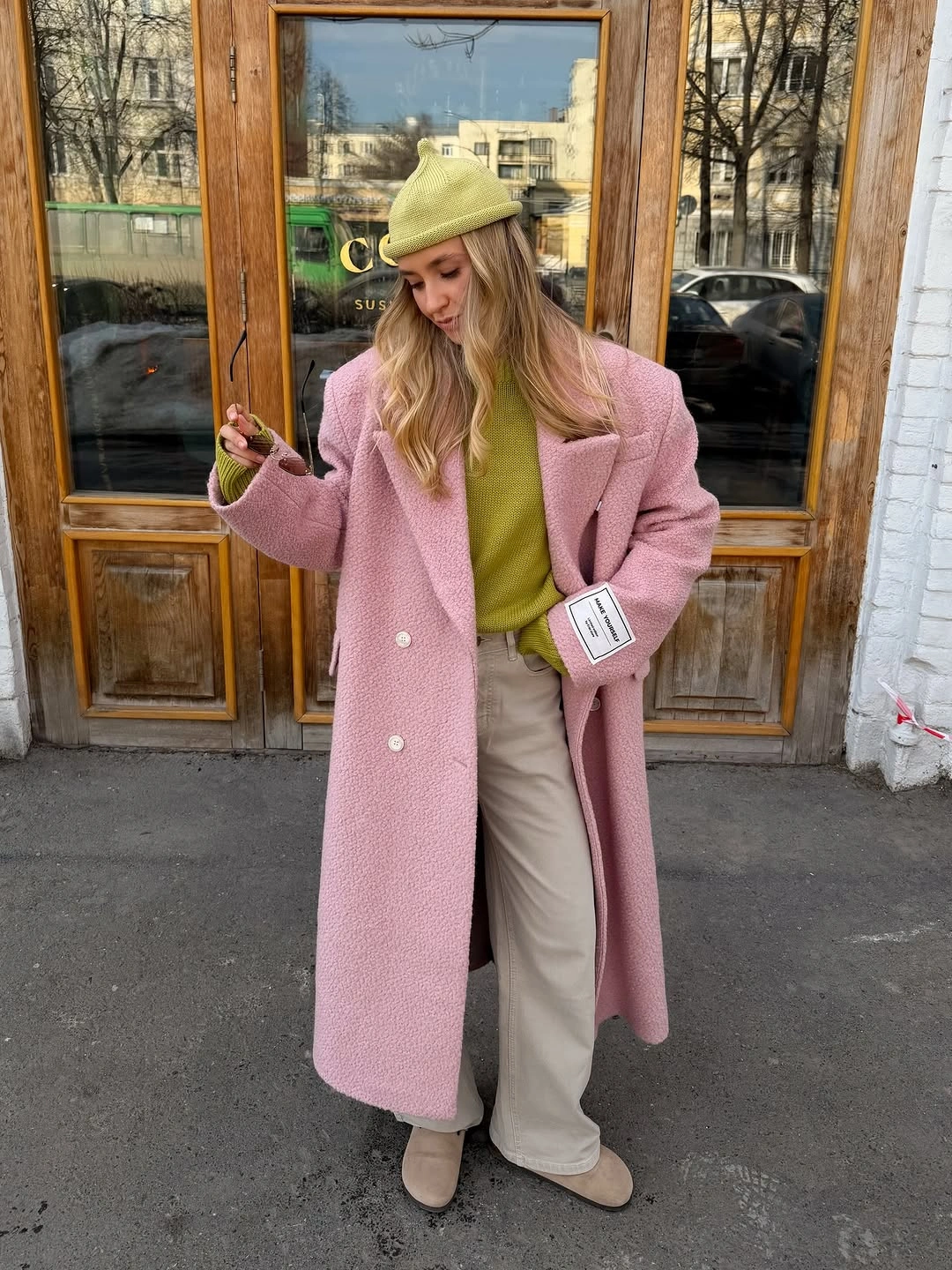 September fashion trends 2026 pink coat and lime green knit outfit