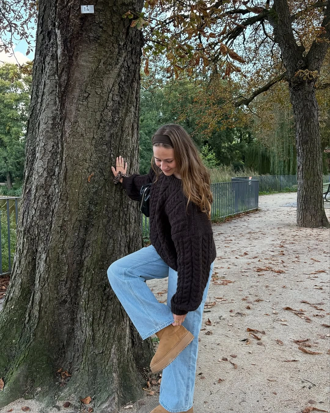 September fashion trends 2026 chunky knit sweater and light denim outfit