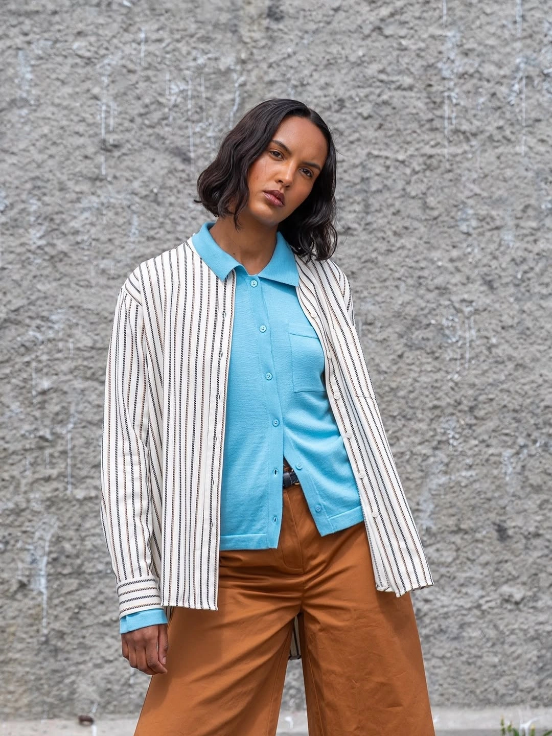 September fashion trends 2026 powder blue polo and brown trousers