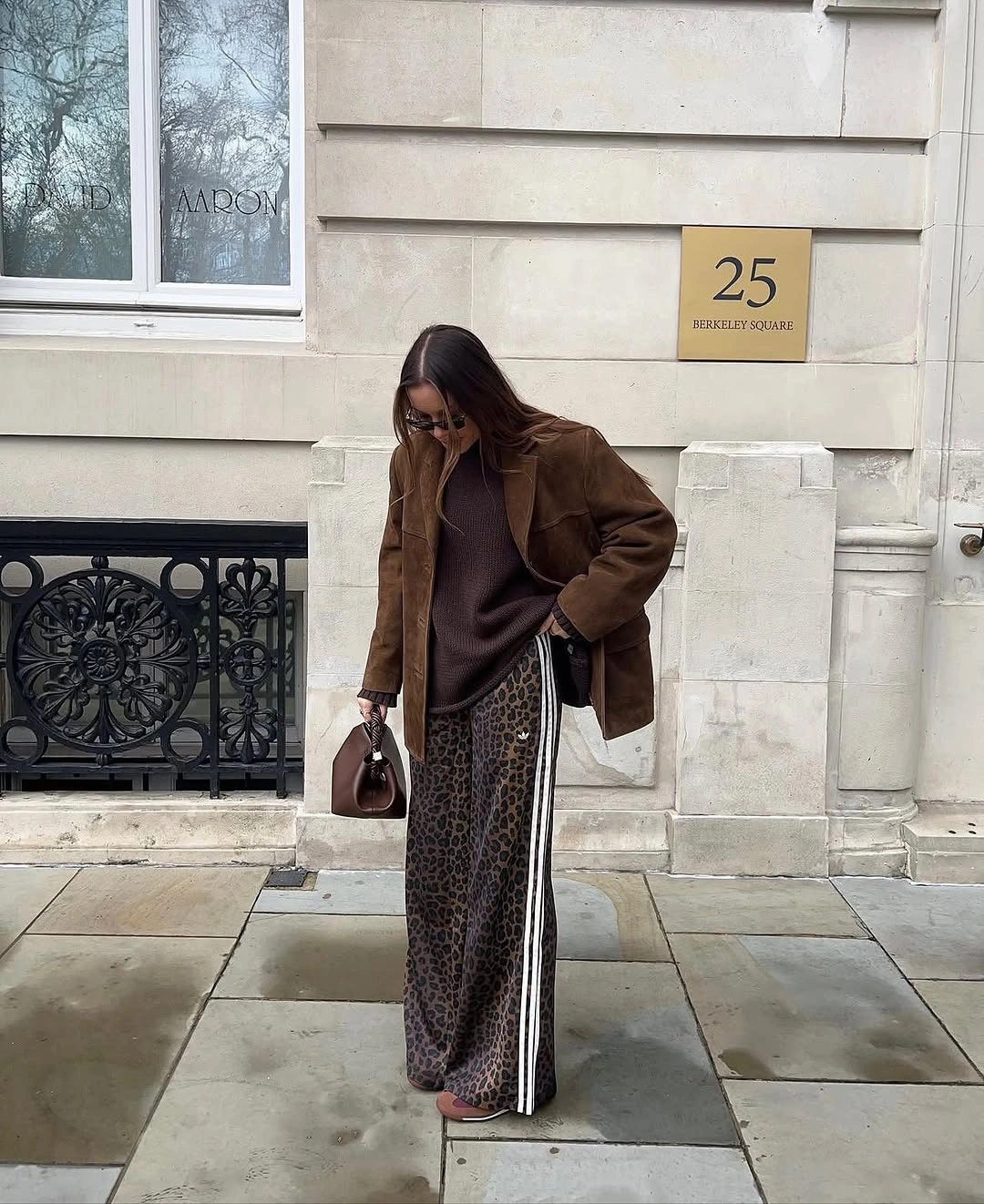 September fashion trends 2026 brown leather jacket and leopard trousers