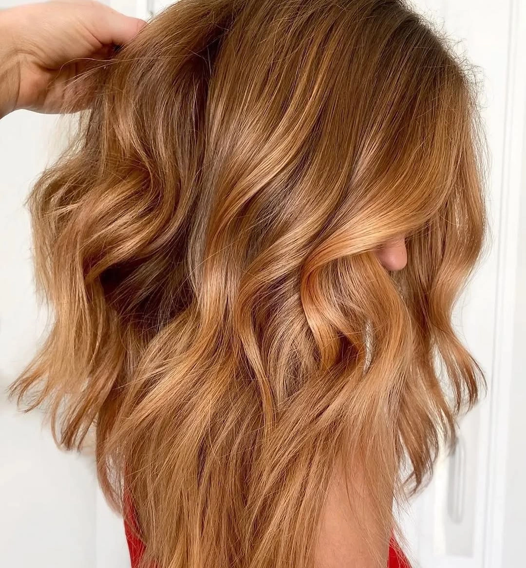 September hair Colour trends 2026 golden caramel brown with soft layered waves