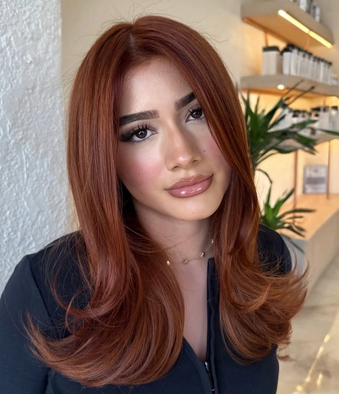 September hair Colour trends 2026 soft cinnamon auburn with bouncy face framing