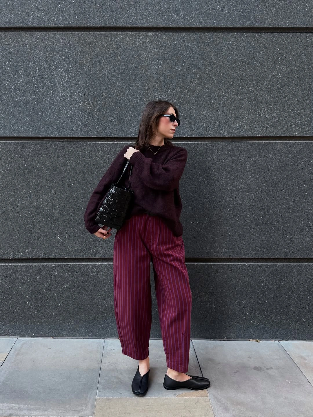 September outfit ideas 2026 Burgundy knit and pinstriped trousers for rich September color