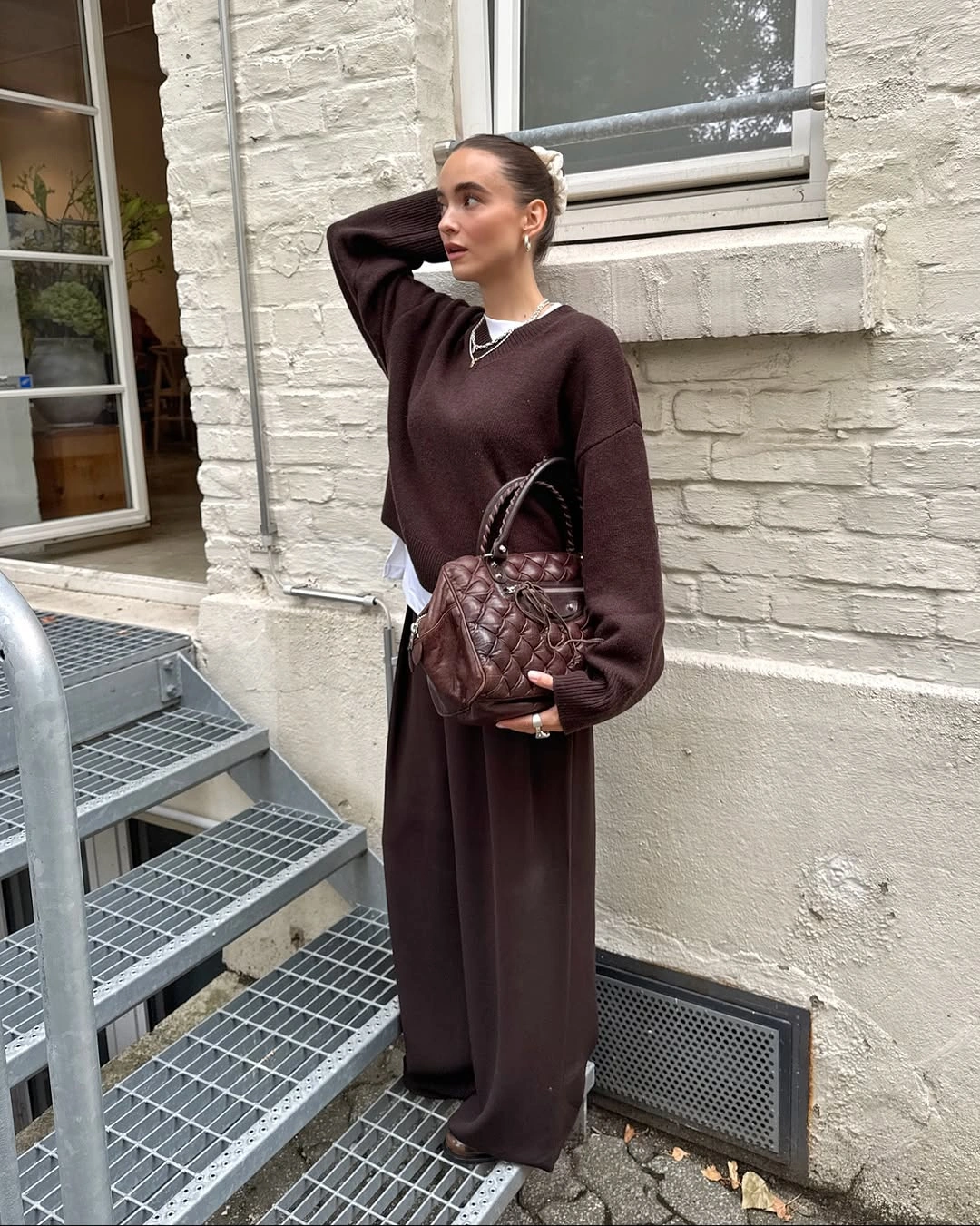 September outfit ideas 2026 chocolate knit and wide-leg trousers for a rich monochromatic September look