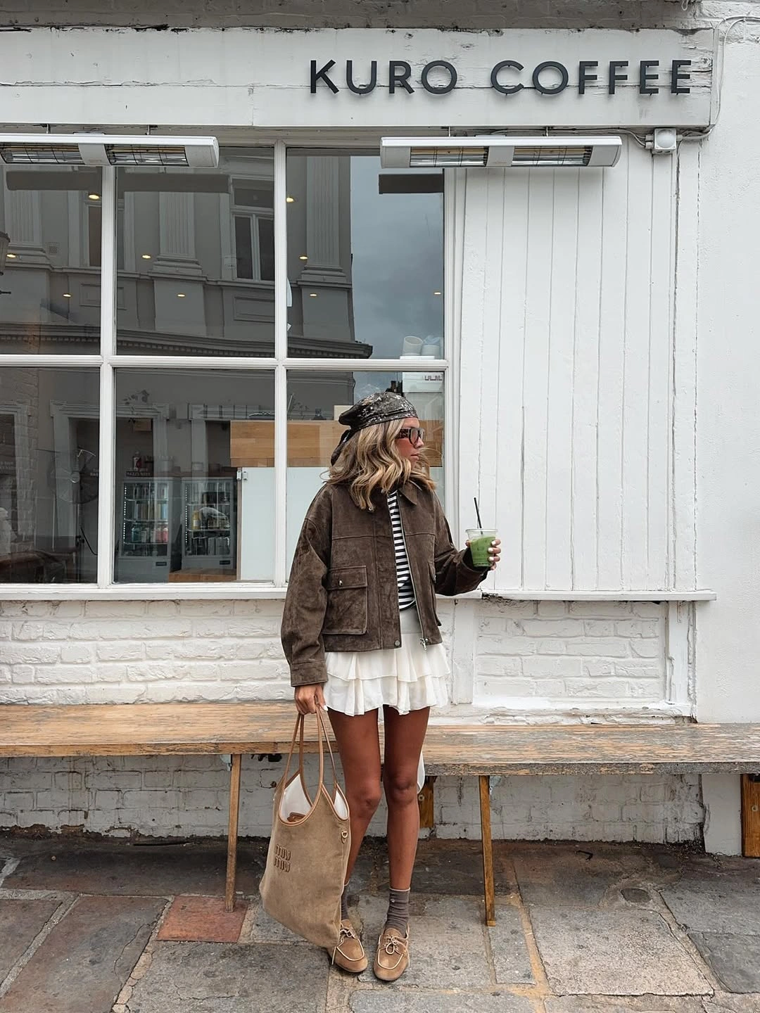September outfit ideas 2026 brown jacket and layered mini skirt for relaxed September coffee runs