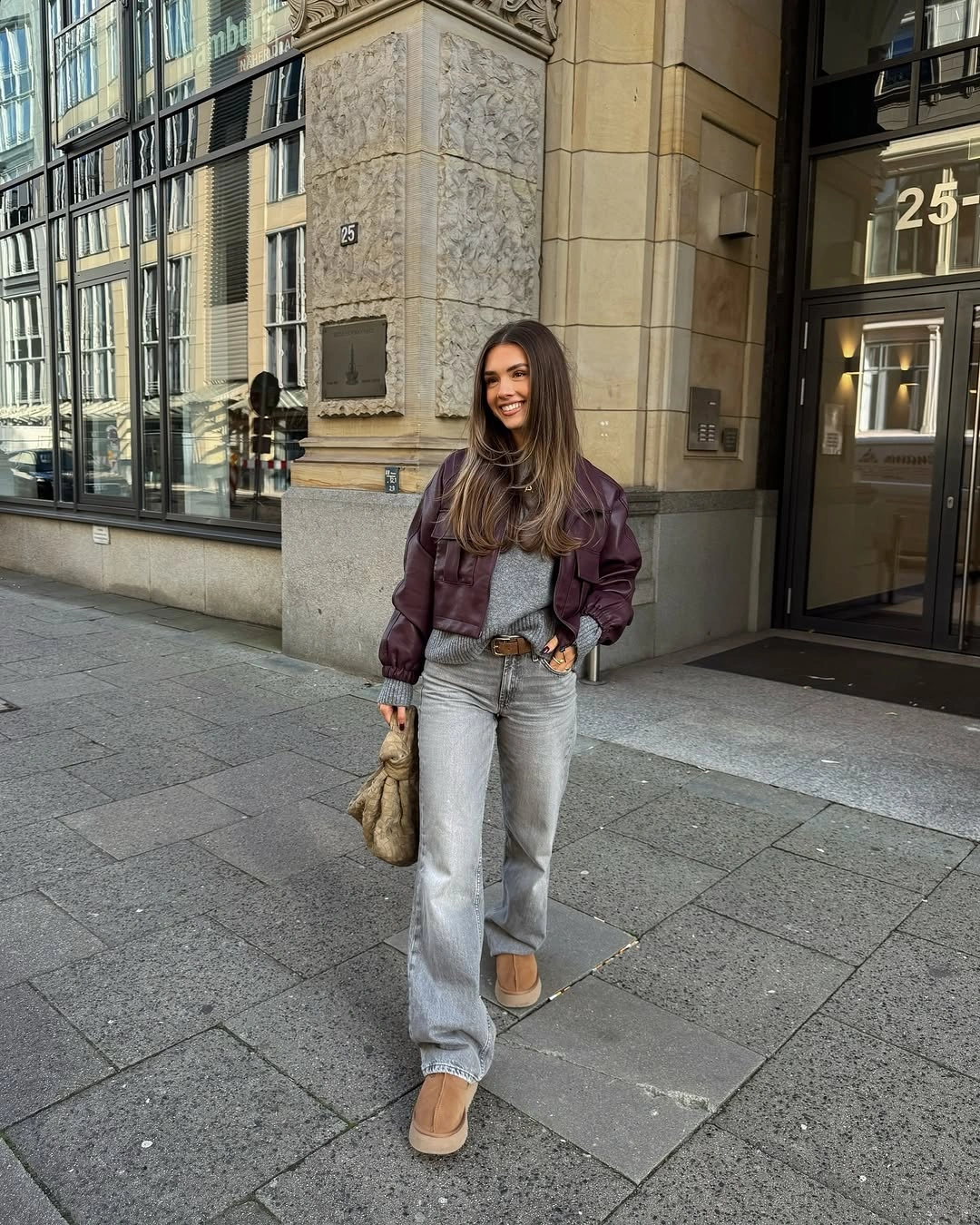 September outfit ideas 2026 Leather jacket gray knit and relaxed jeans