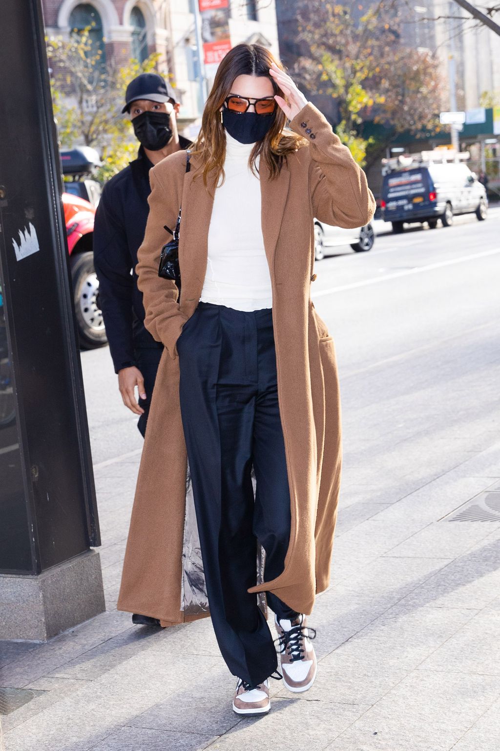 Long Camel Coat Over White Turtleneck and Navy Trousers — Winter Outfits