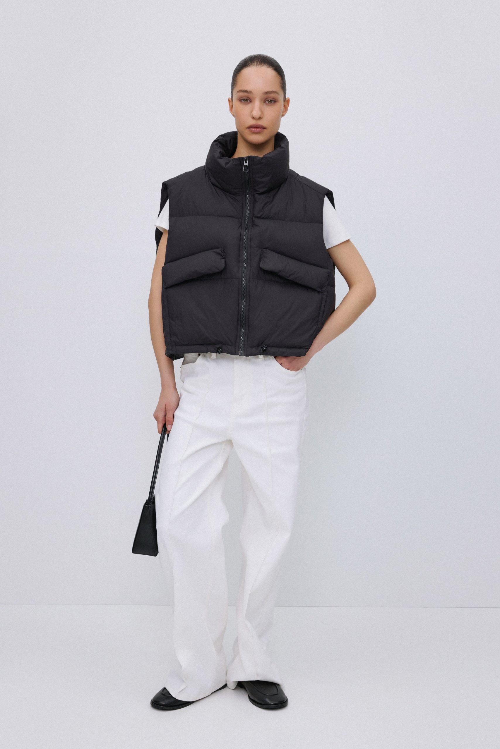 Cropped Black Puffer Vest with White T-Shirt and Trousers — Puffer Vest Outfits