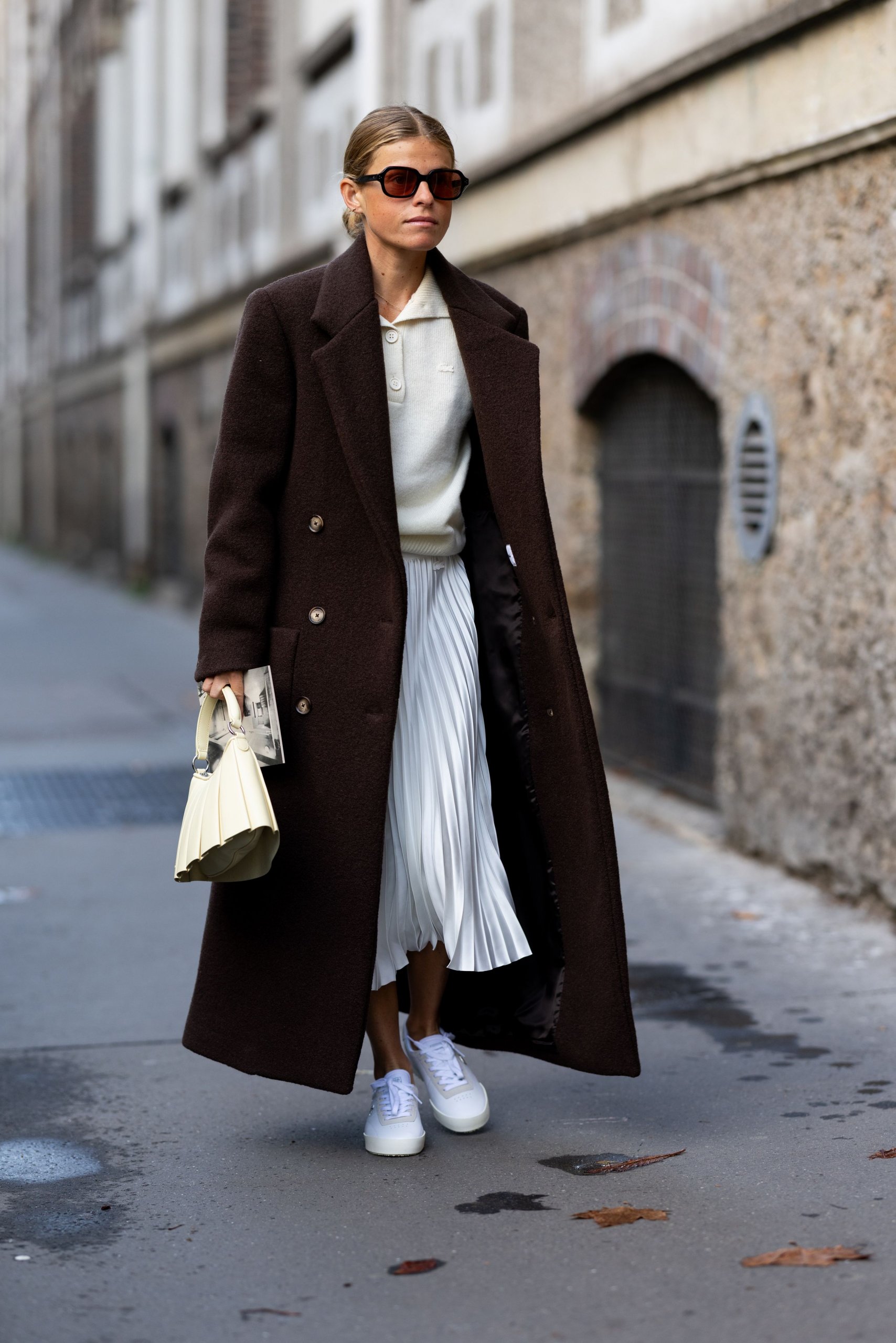Contrast a Dark Brown Wool Coat with a Cream Knit Top and Pleated Skirt Contrast a Dark Brown Wool Coat with a Cream Knit Top and Pleated Skirt — Brown Coat Outfits