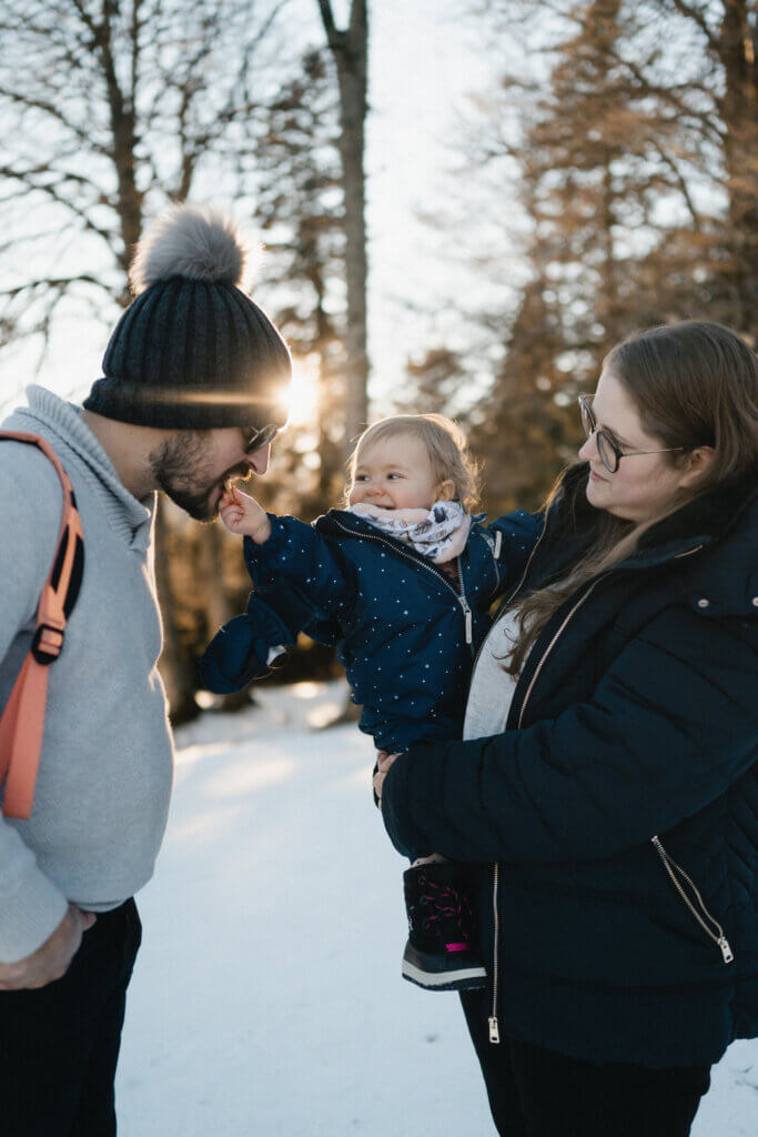 Warm Puffer Coats and Scarves for a Snowy Family Scene — Winter Family Photo Outfits