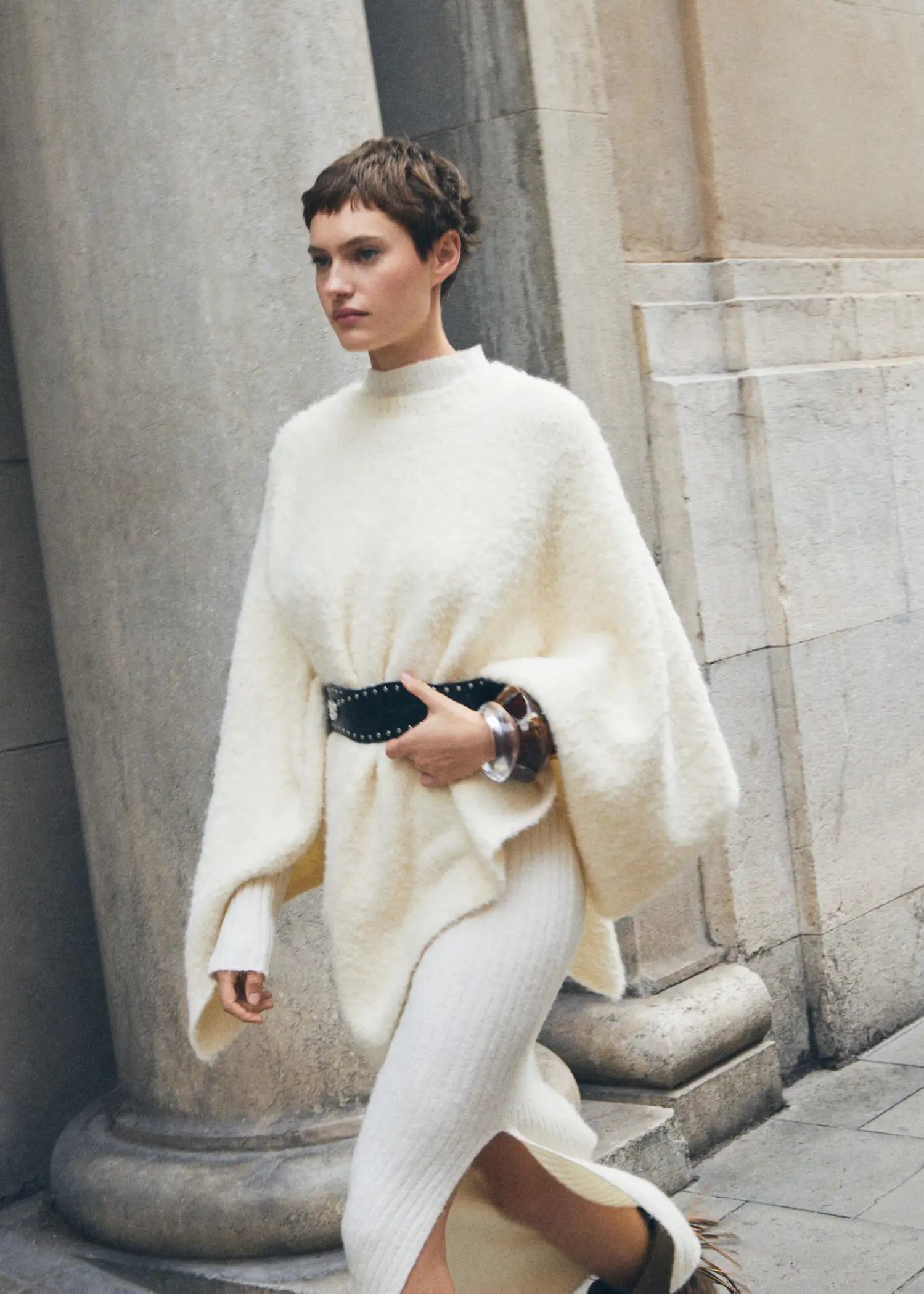 Cream Knit Poncho Over Dress with Studded Belt — Winter Layering Outfits