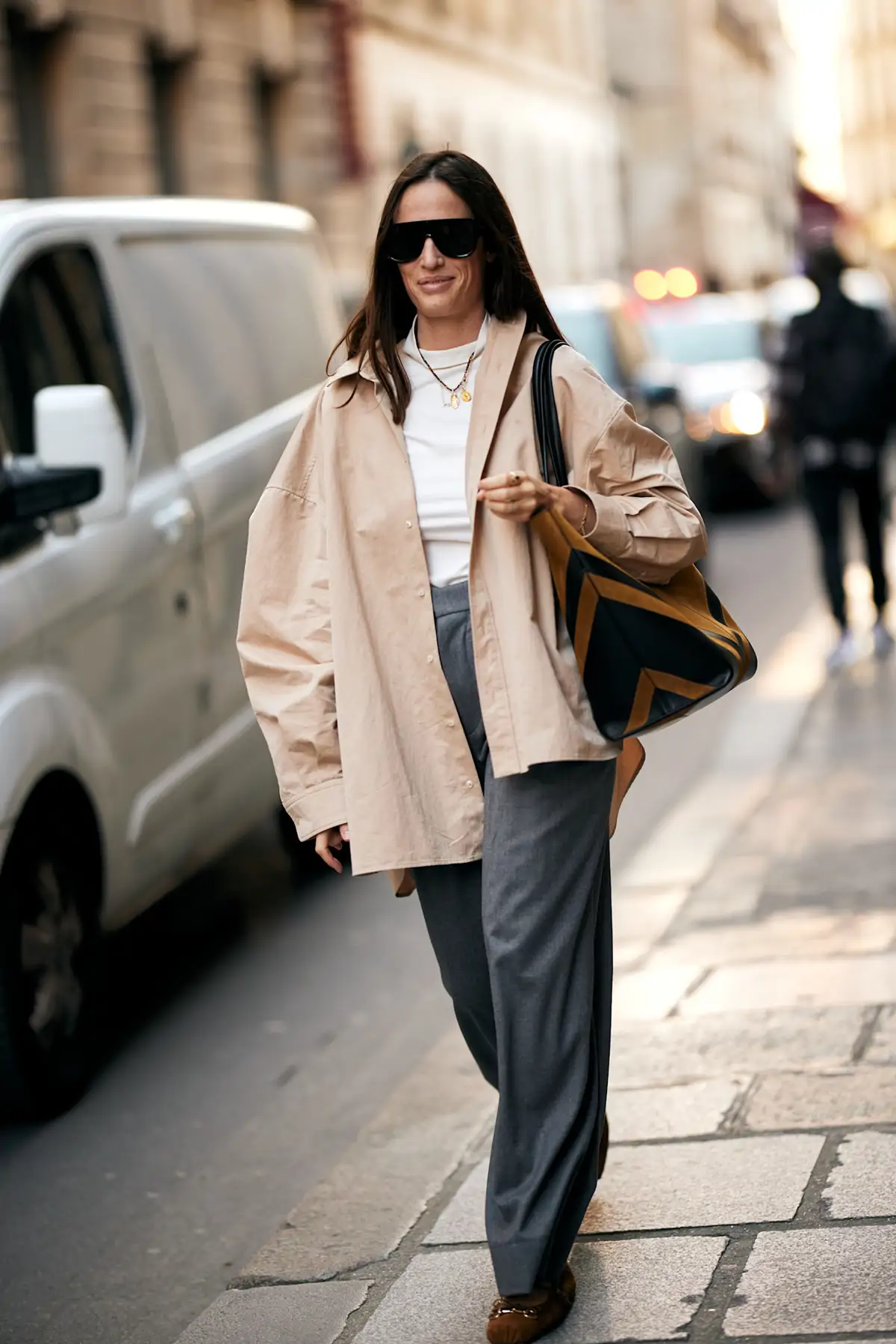 Oversized Beige Shirt Over a White T-shirt and Grey Trousers Oversized Beige Shirt Over a White T-shirt and Grey Trousers — Winter to Spring Transition Outfits