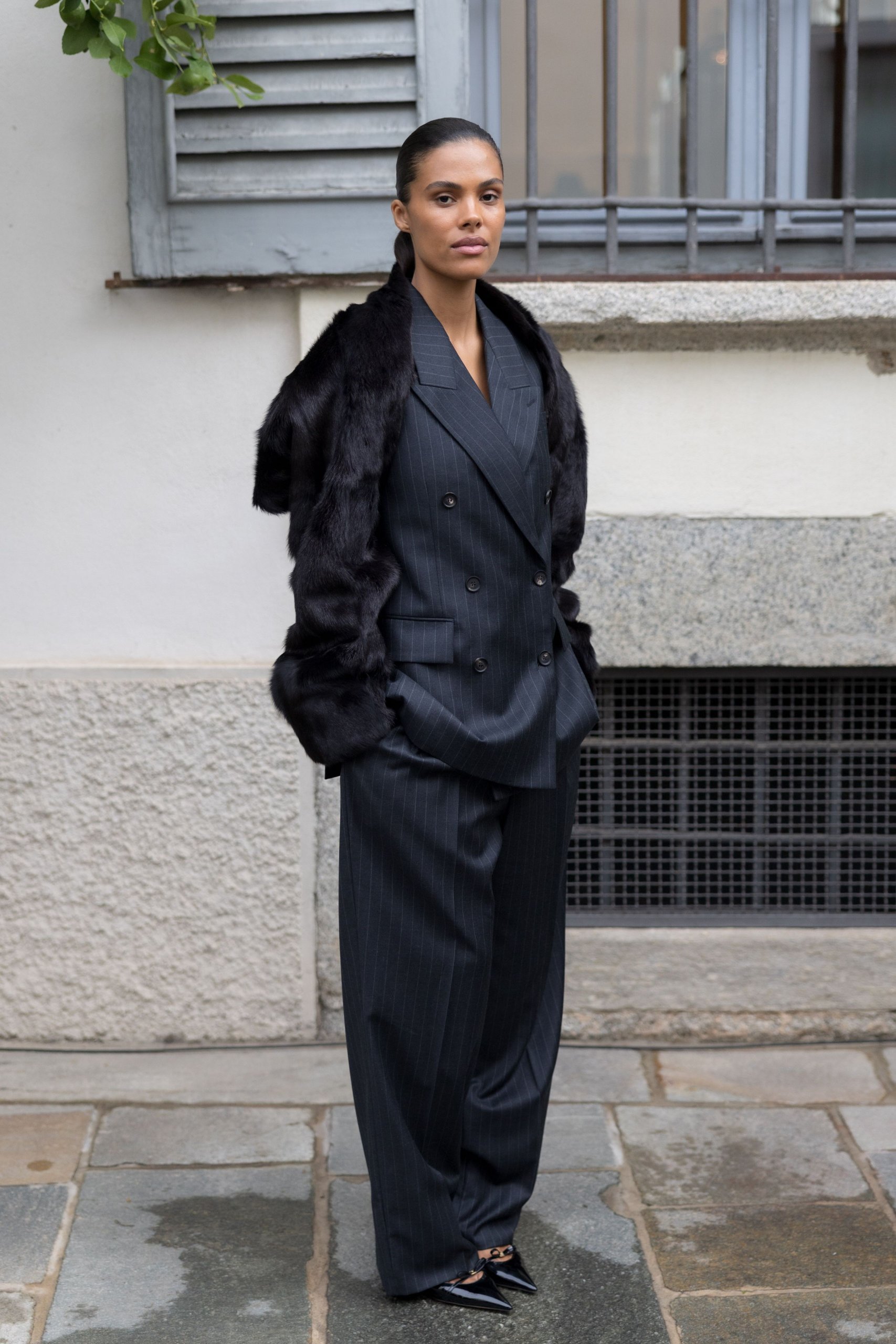 Oversized Black Pinstripe Double-Breasted Suit Accented with a Faux Fur Stole — Winter Business Casual Outfits