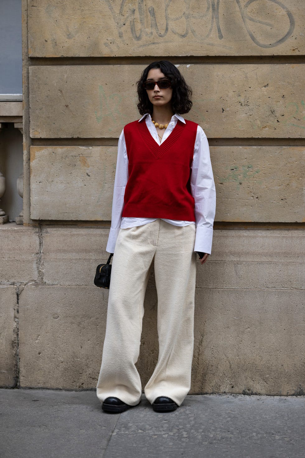 Red V-Neck Sweater Vest Over Collared Shirt with Wide-Leg Trousers Red V-Neck Sweater Vest Over Collared Shirt with Wide-Leg Trousers — Sweater Outfits