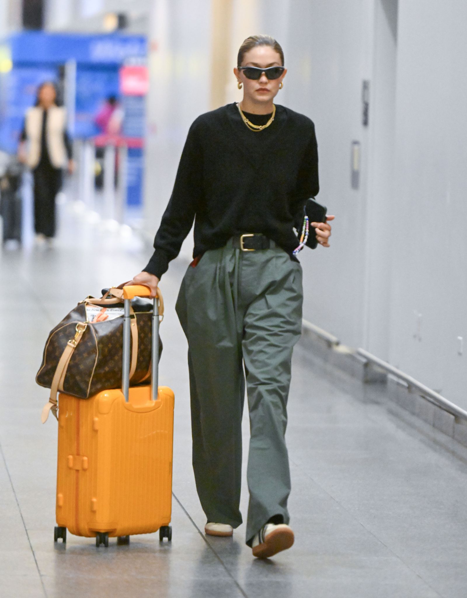 Olive Green Trousers and Crewneck Sweater for a Chic Ensemble — Winter Airport Outfits
