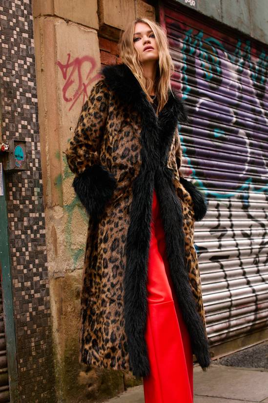 Dramatic Leopard Coat with Vibrant Red Trousers Dramatic Leopard Coat with Vibrant Red Trousers — Leopard Coat Outfits