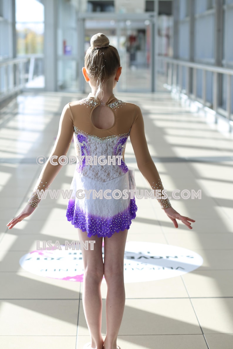 Leotard with White and Purple Beaded Skirt and Rhinestone Embellishments Leotard with White and Purple Beaded Skirt and Rhinestone Embellishments — Ice Skating Outfits