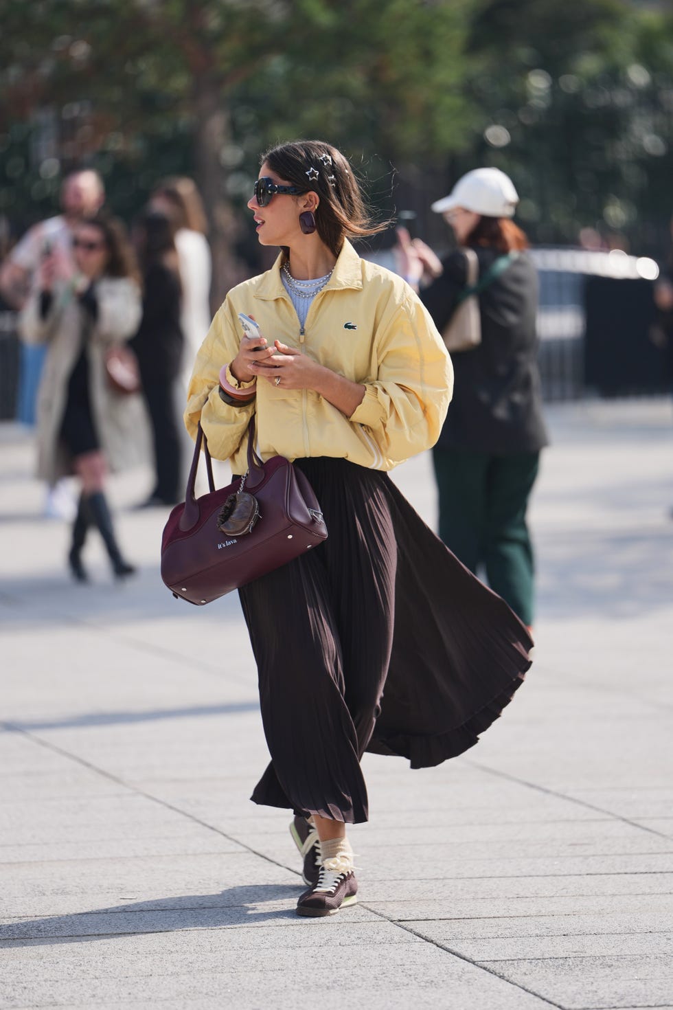 Yellow Zip-Up Jacket Over a Light Blue Sweater and Pleated Skirt Yellow Zip-Up Jacket Over a Light Blue Sweater and Pleated Skirt — Winter to Spring Transition Outfits