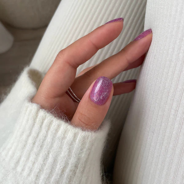 Shimmering Pink with Purple Glitter Nails Shimmering Pink with Purple Glitter Nails — Winter Nail Colors for Pale Skin