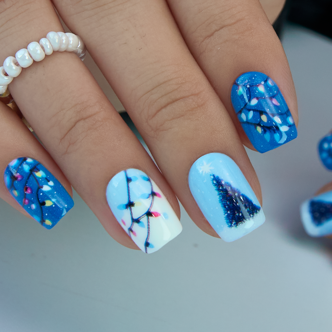 Festive Blue and White Squovals with Motifs Festive Blue and White Squovals with Motifs — Winter Squoval Nails