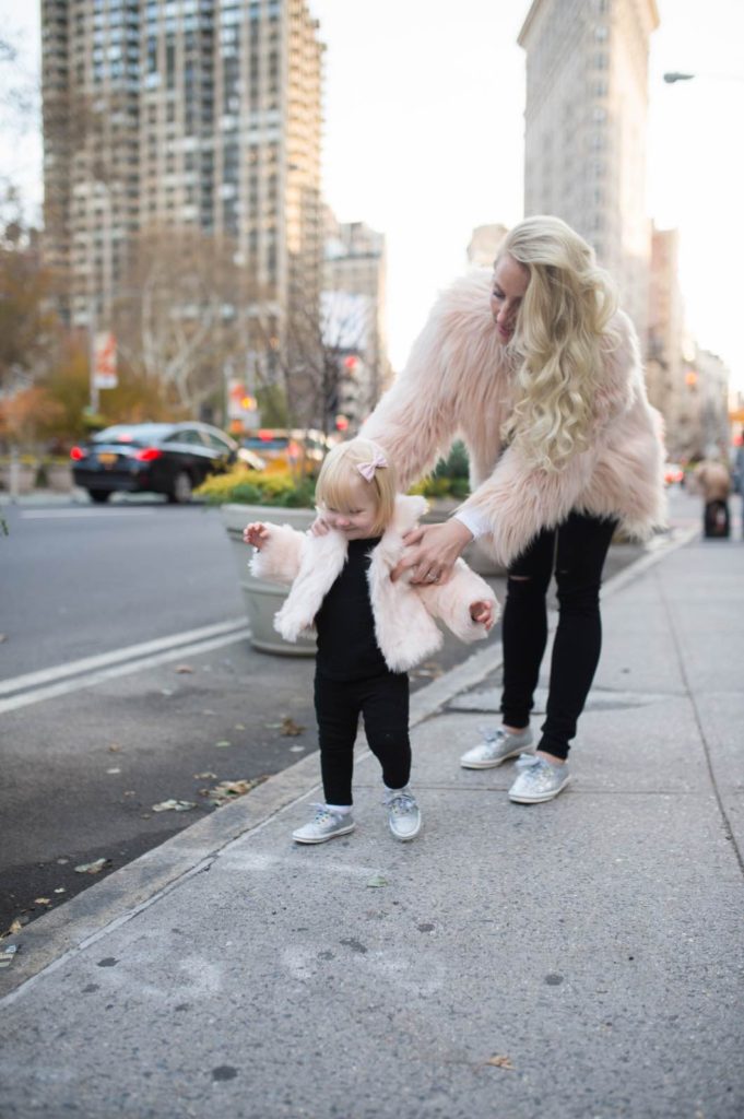 Pink Faux Fur Coat Styled Over Simple Black Layers Pink Faux Fur Coat Styled Over Simple Black Layers — Winter Outfits for Moms