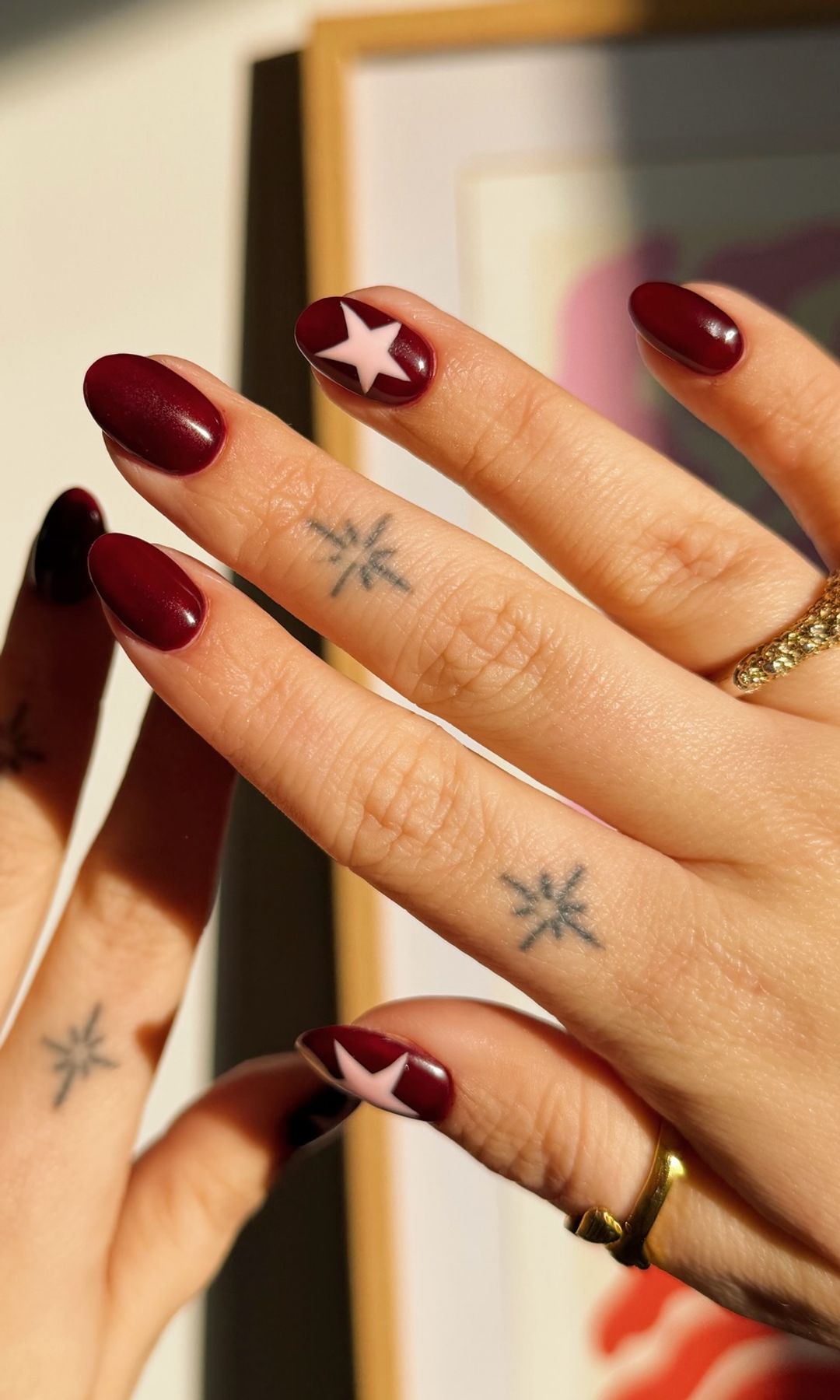 Burgundy with Pink Star Accent Burgundy with Pink Star Accent — Winter Nail Colors for Women Over 60