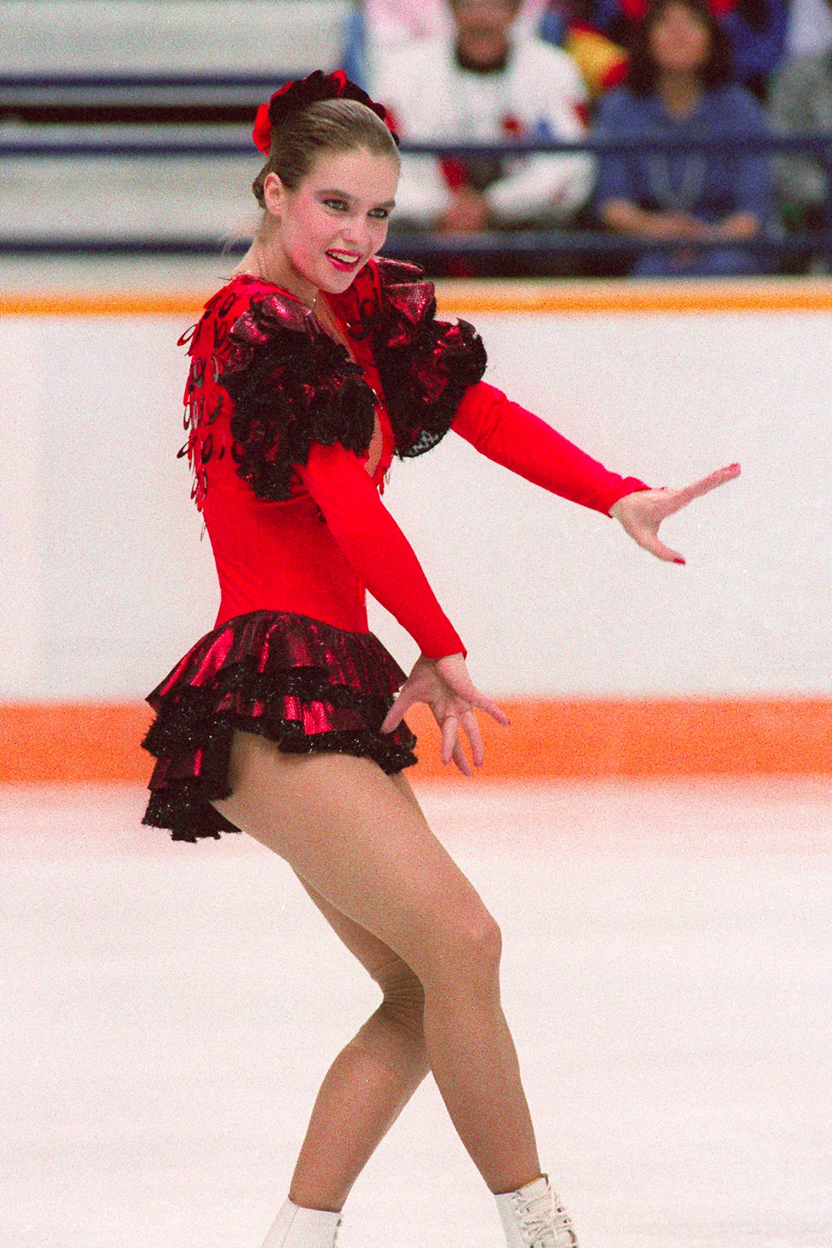 Red Sequined Ice Skating Costume with Black Ruffled Skirt and Shoulder Accents Red Sequined Ice Skating Costume with Black Ruffled Skirt and Shoulder Accents — Ice Skating Outfits