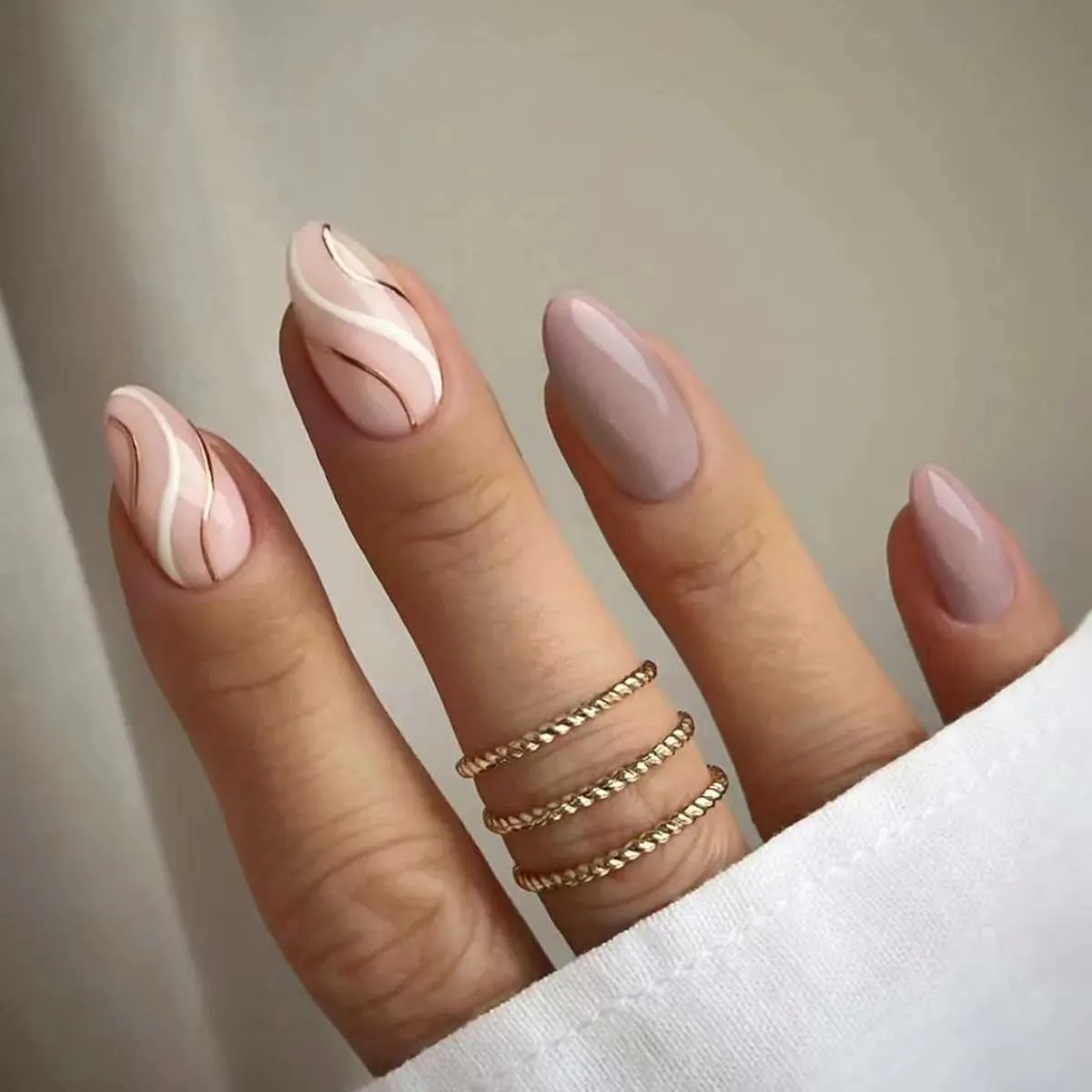 Pale Pink Beige with Rose Gold Swirls — Winter Almond Nails