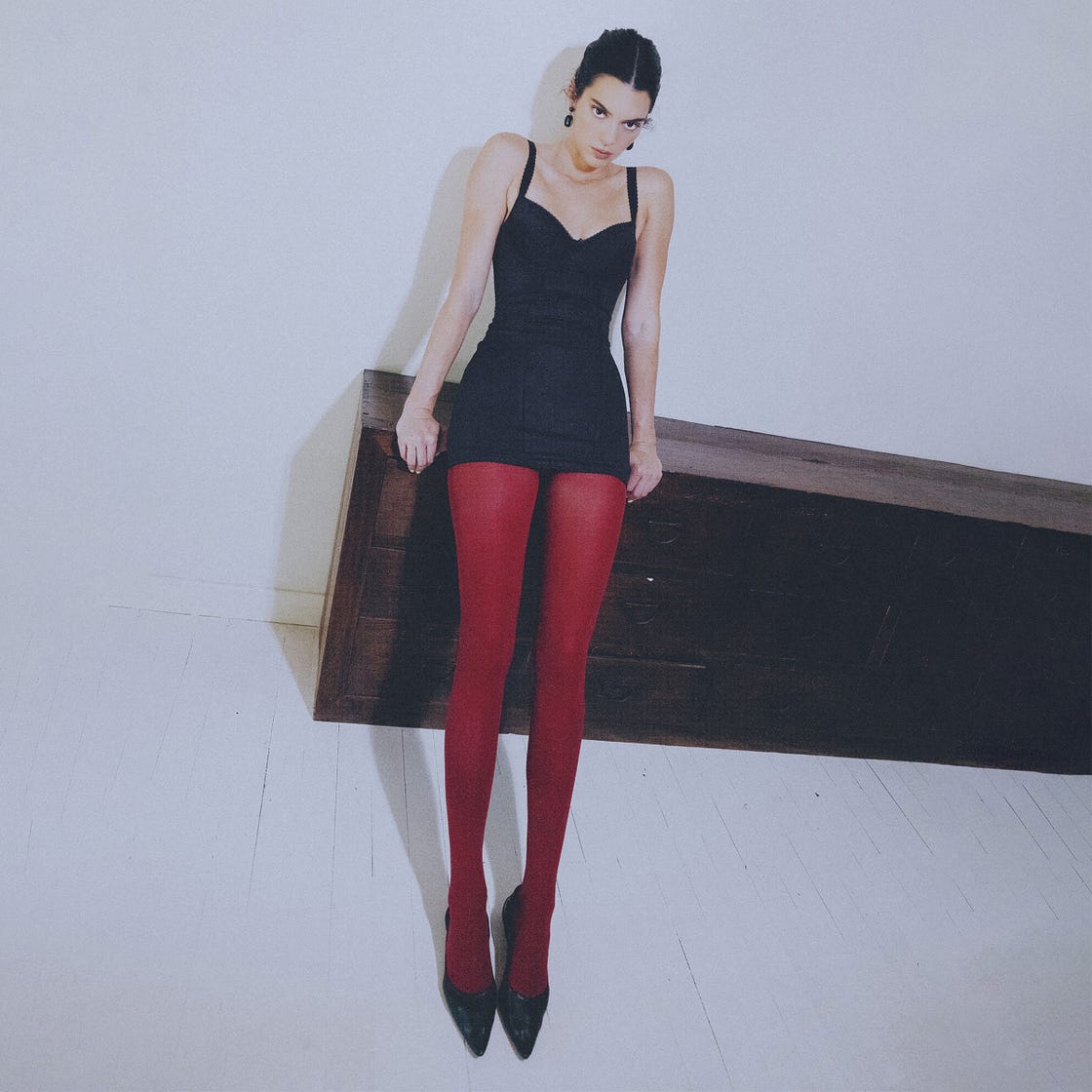 Striking Contrast: Red Tights with a Black Satin Mini Dress Striking Contrast: Red Tights with a Black Satin Mini Dress — Tights Outfits