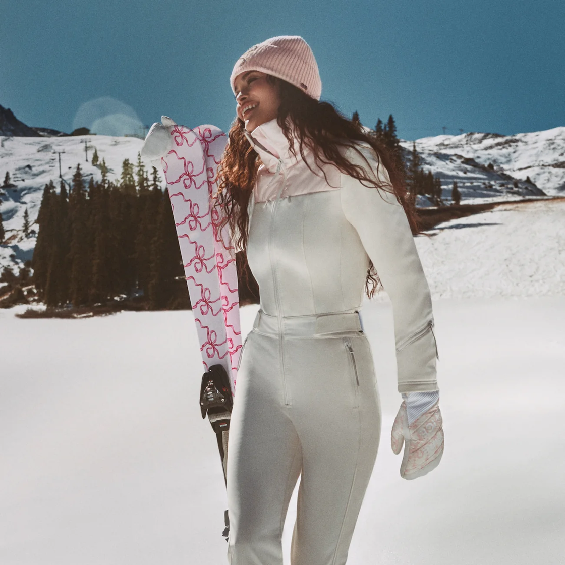 White Ski Suit with Feminine Pink Trim and Bows White Ski Suit with Feminine Pink Trim and Bows — Ski Outfits