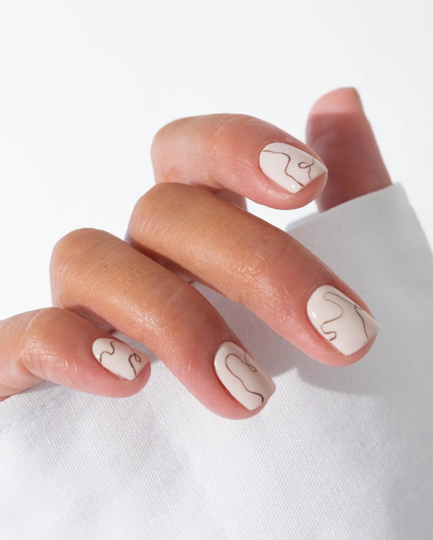 Nude with Abstract Beige Lines Nude with Abstract Beige Lines — Winter Nail Colors for Women Over 60
