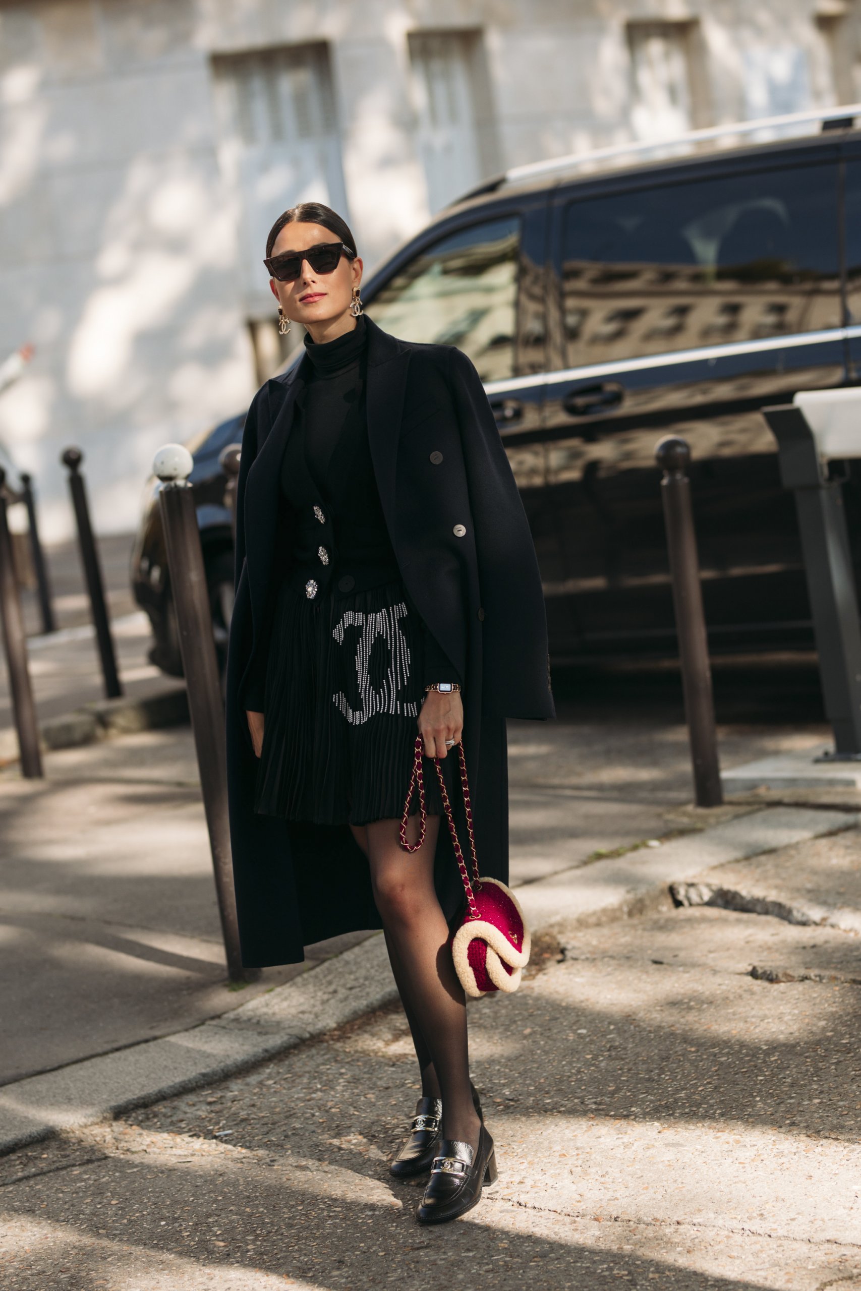 Navy Coat Draped Over Embellished Skirt and Turtleneck — Winter Layering Outfits