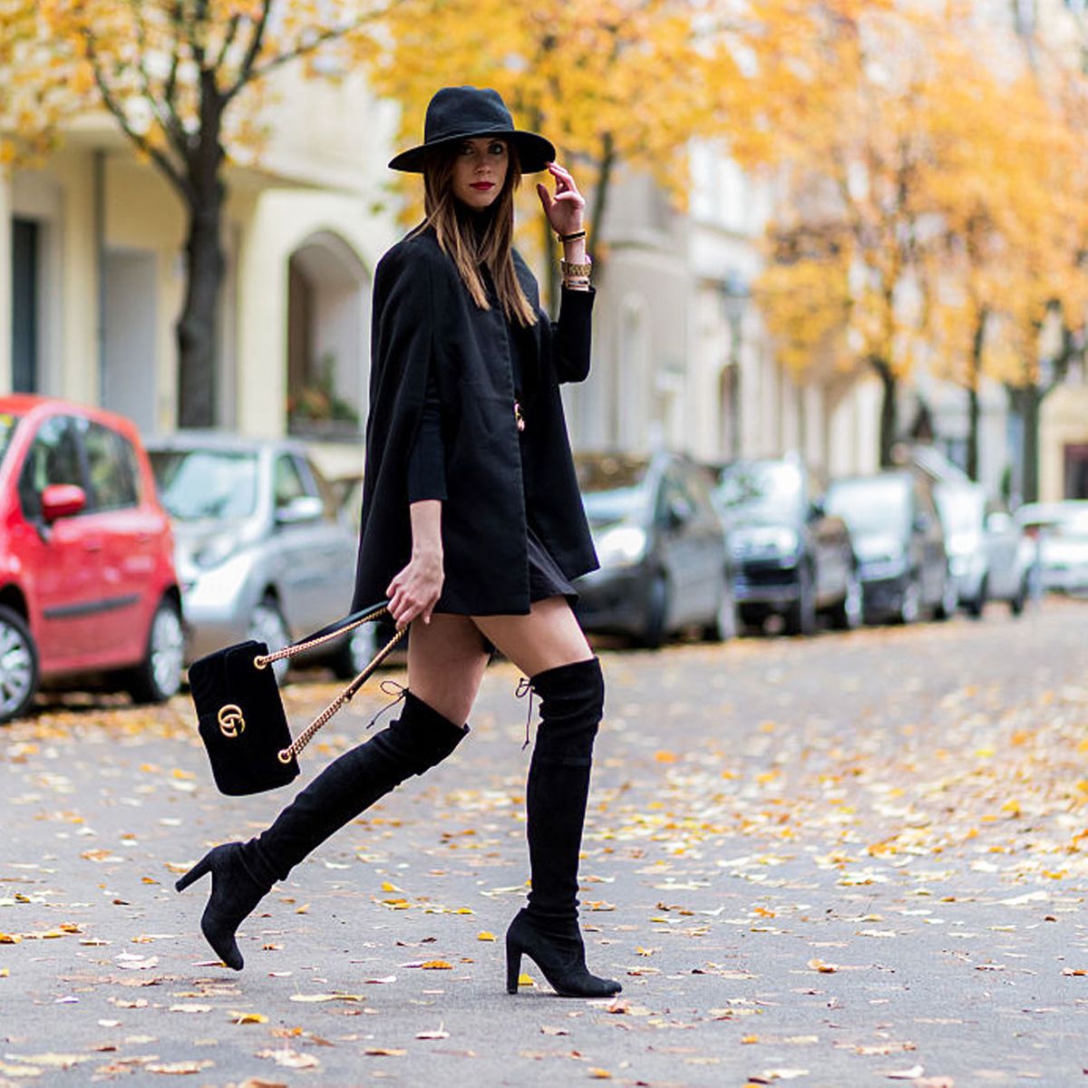 Monochromatic Black: Suede Boots, Mini Skirt, and Cape Coat Monochromatic Black: Suede Boots, Mini Skirt, and Cape Coat — Knee High Boots Outfits