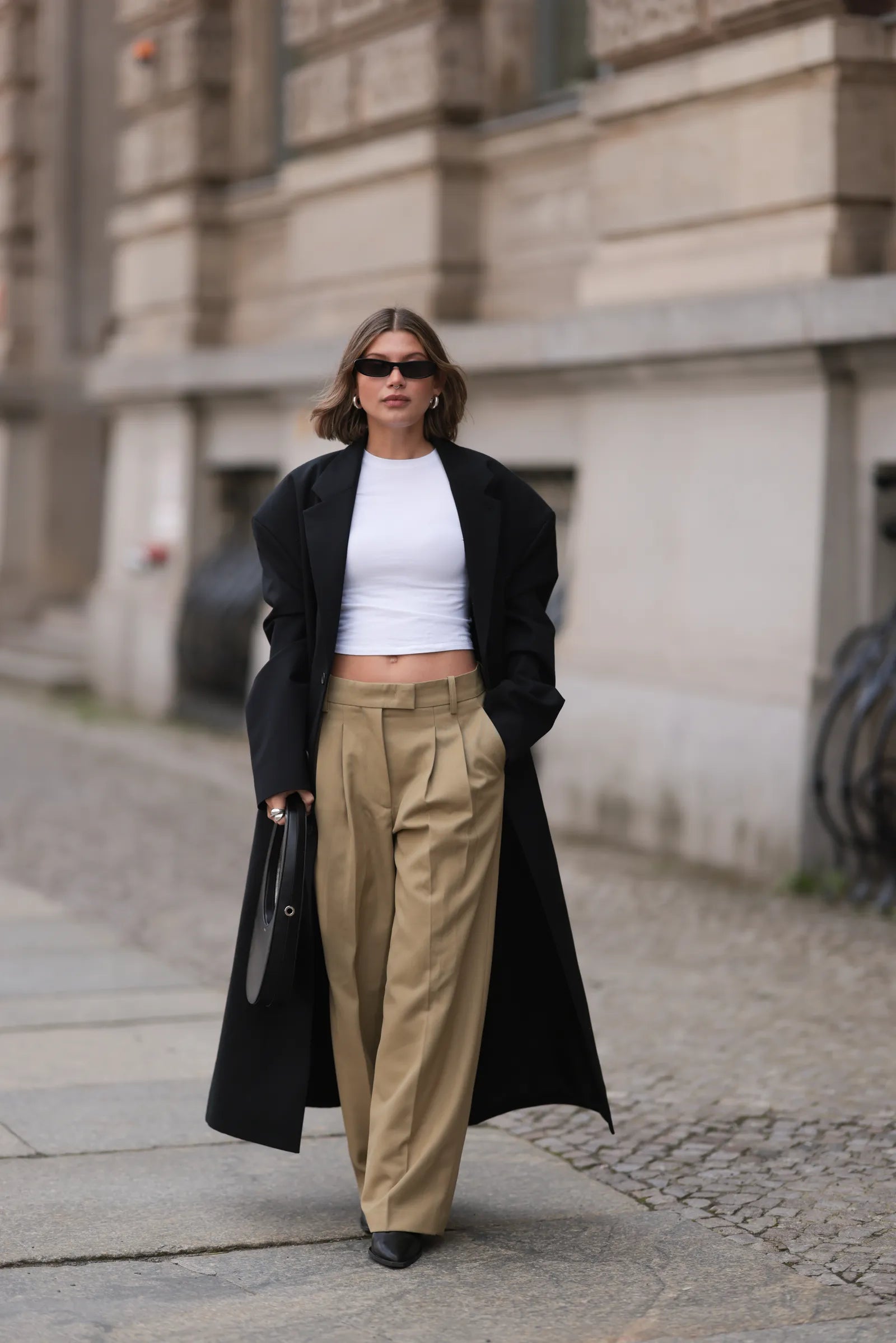 Structured Black Long Coat with Cropped Tee and Khaki Trousers — Long Coat Outfits