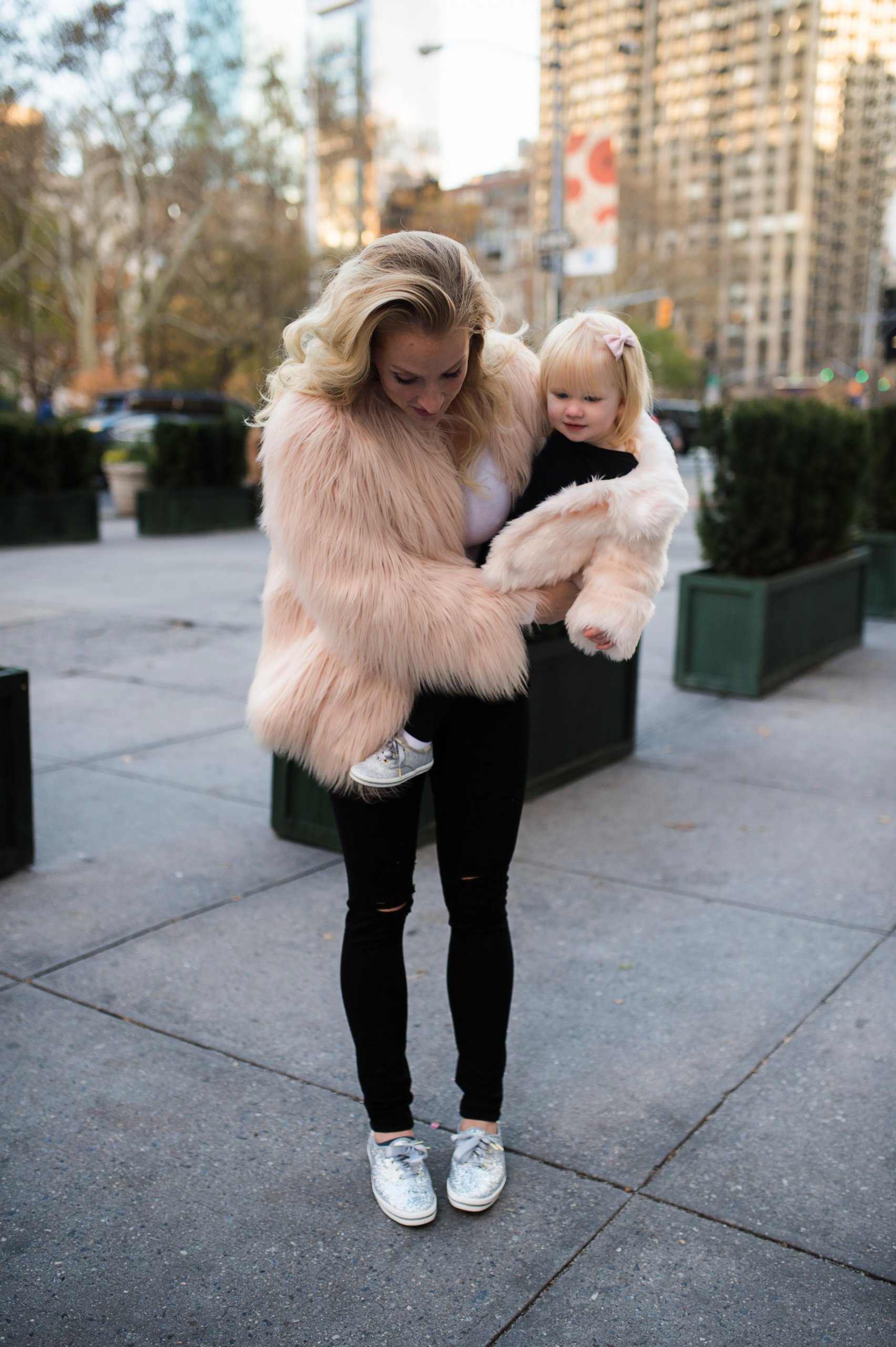 Pink Faux Fur Coat with Black Pants and Silver Sneakers Pink Faux Fur Coat with Black Pants and Silver Sneakers — Winter Outfits for Moms