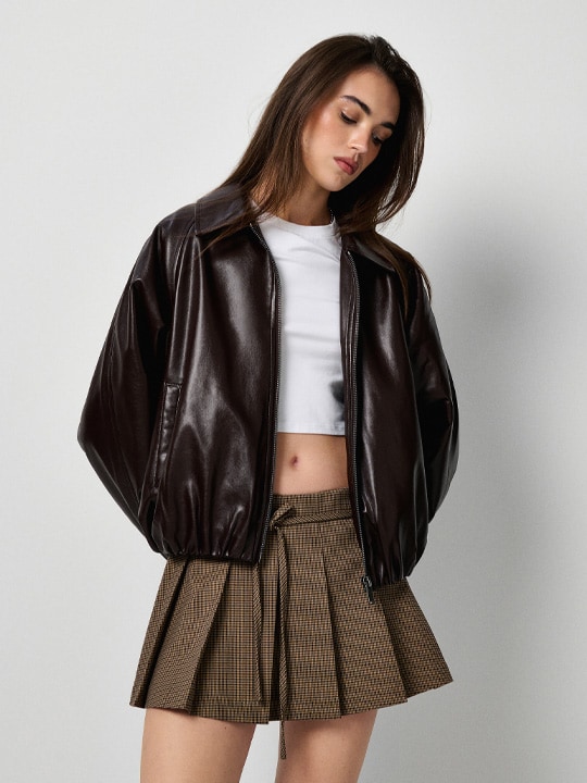 Youthful Edge: Faux Leather Bomber with Plaid Mini Skirt Youthful Edge: Faux Leather Bomber with Plaid Mini Skirt — Winter College Outfits