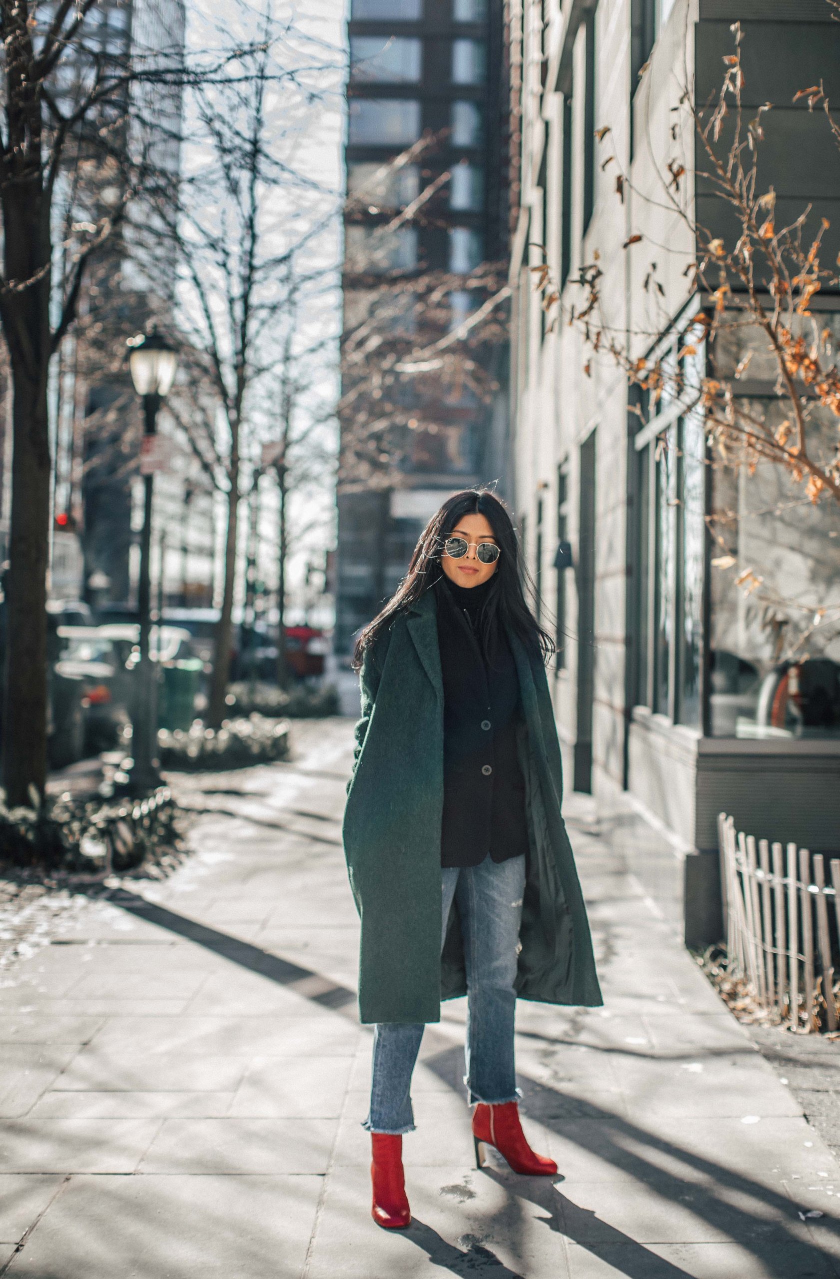 Vibrant Red Ankle Boots Pop Against Green Coat and Blue Jeans Vibrant Red Ankle Boots Pop Against Green Coat and Blue Jeans — Ankle Boots Outfits