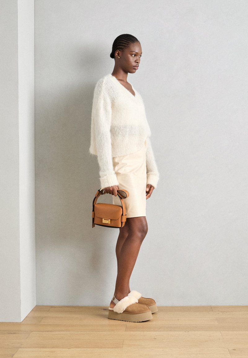 Playful Contrast: Ugg Funkette Platforms with Mini Skirt Playful Contrast: Ugg Funkette Platforms with Mini Skirt — Ugg Slippers Outfits